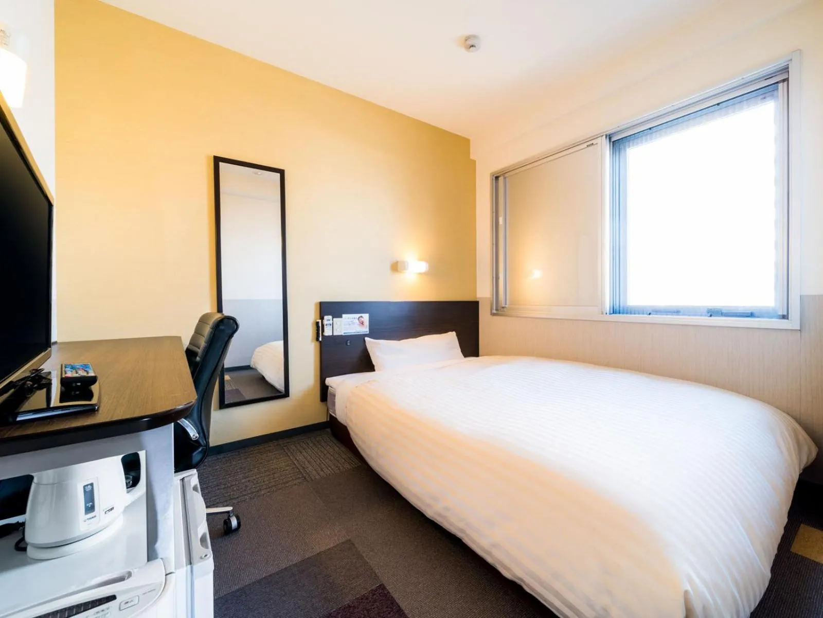 Bed in Super Hotel Fuji Inter