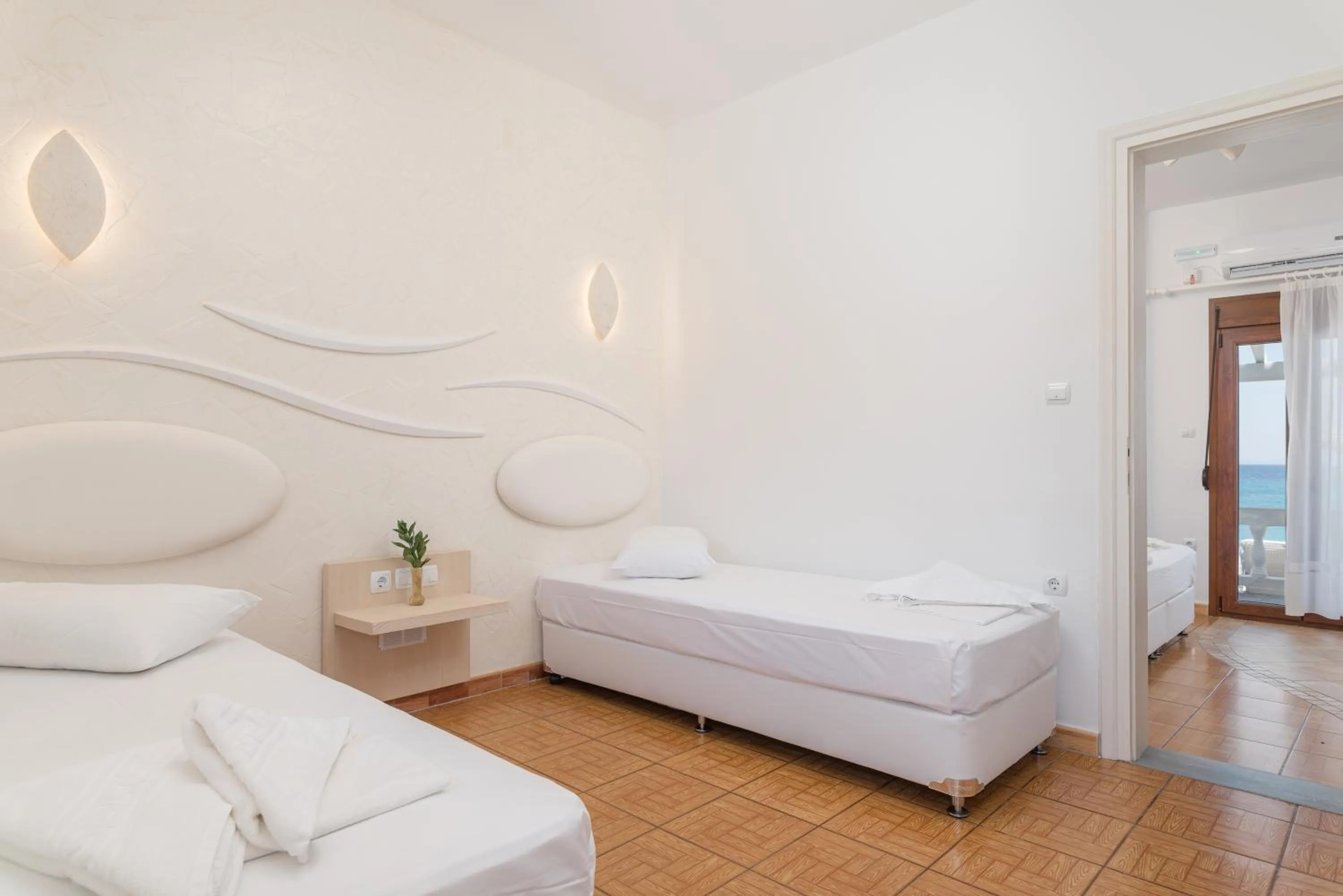 Bed in Kokkari Beach Hotel