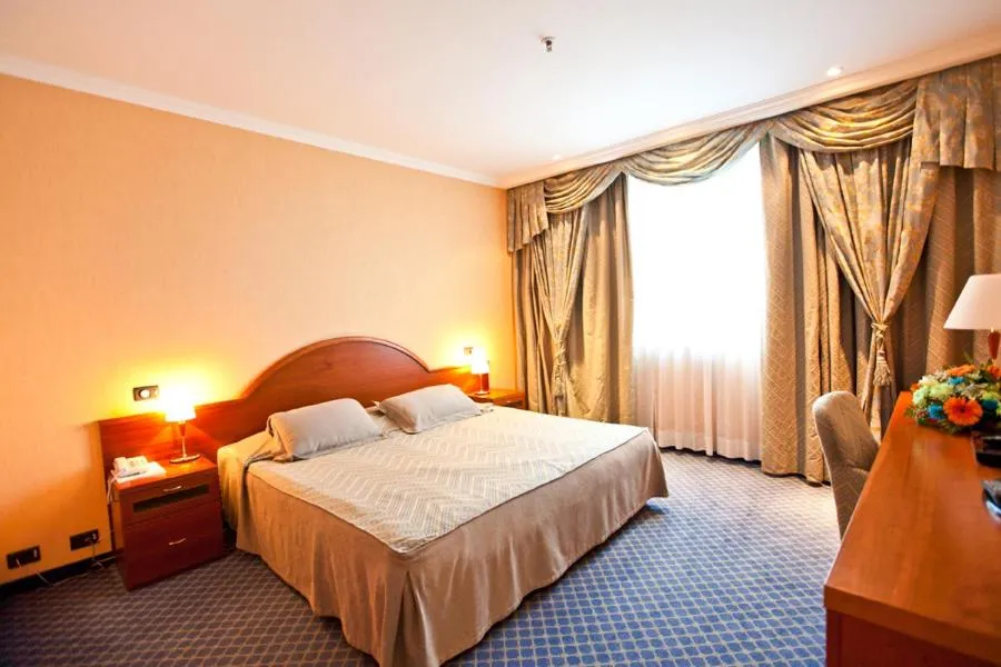 Bed in River Palace Hotel