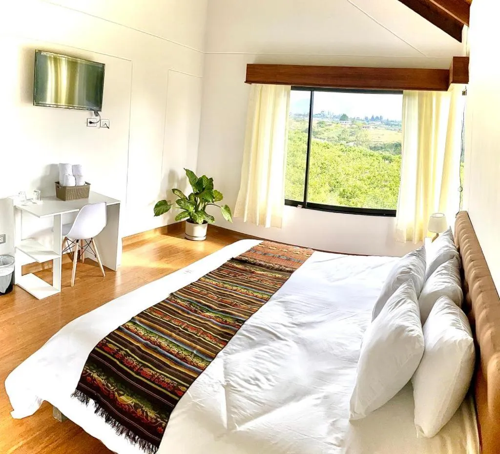 Bed in Quito Airport Suites Hotel