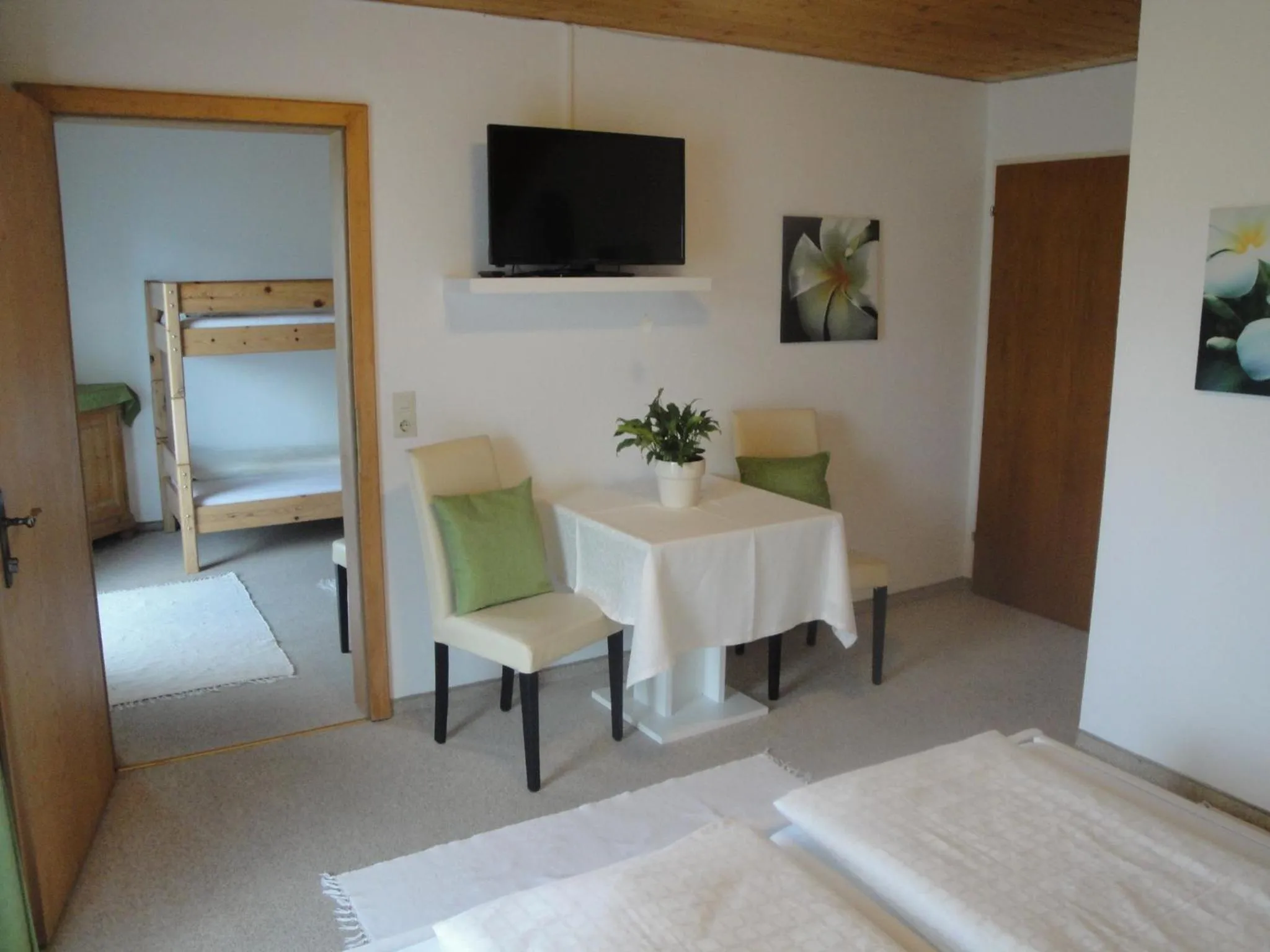 Communal lounge/ TV room, Bed in Hotel Pension Schwaiger