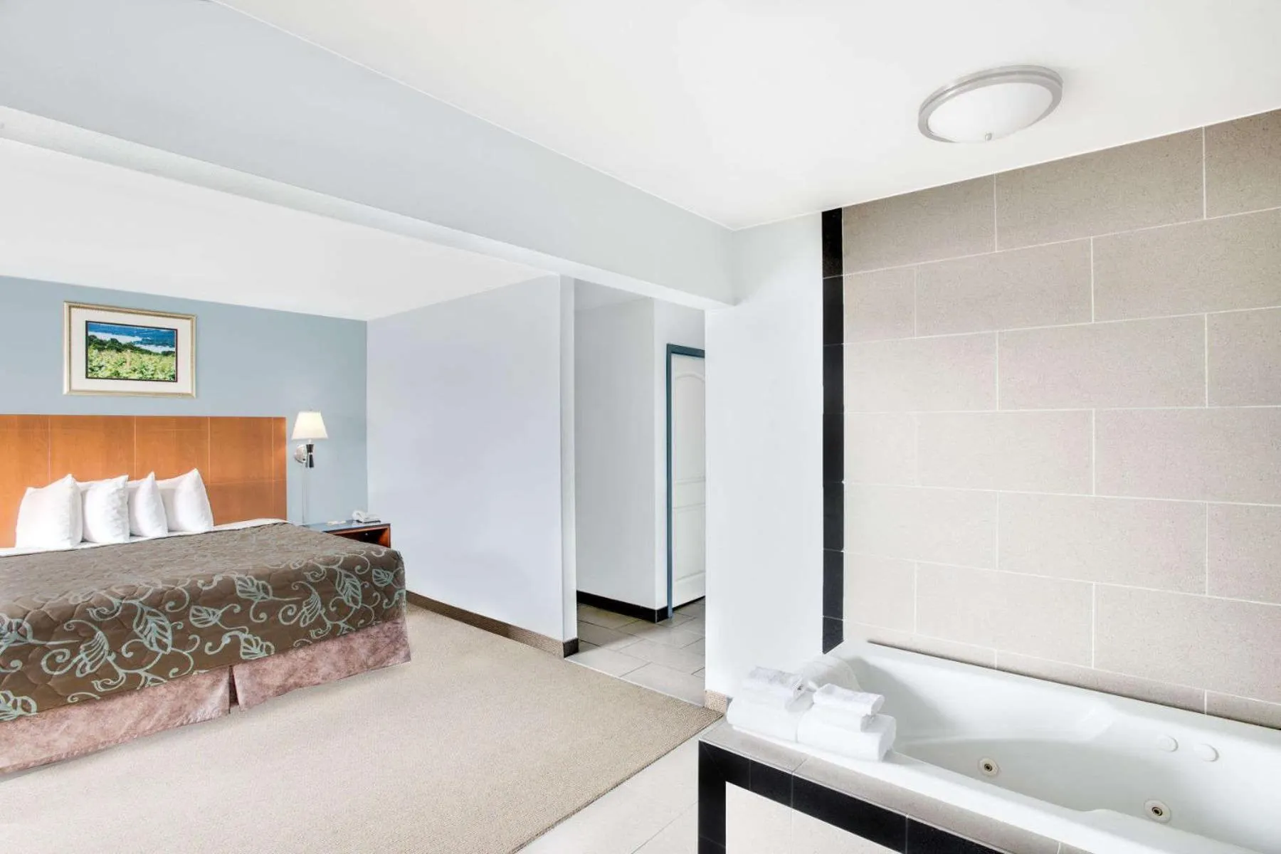 Bed in Days Inn by Wyndham Watertown Fort Drum