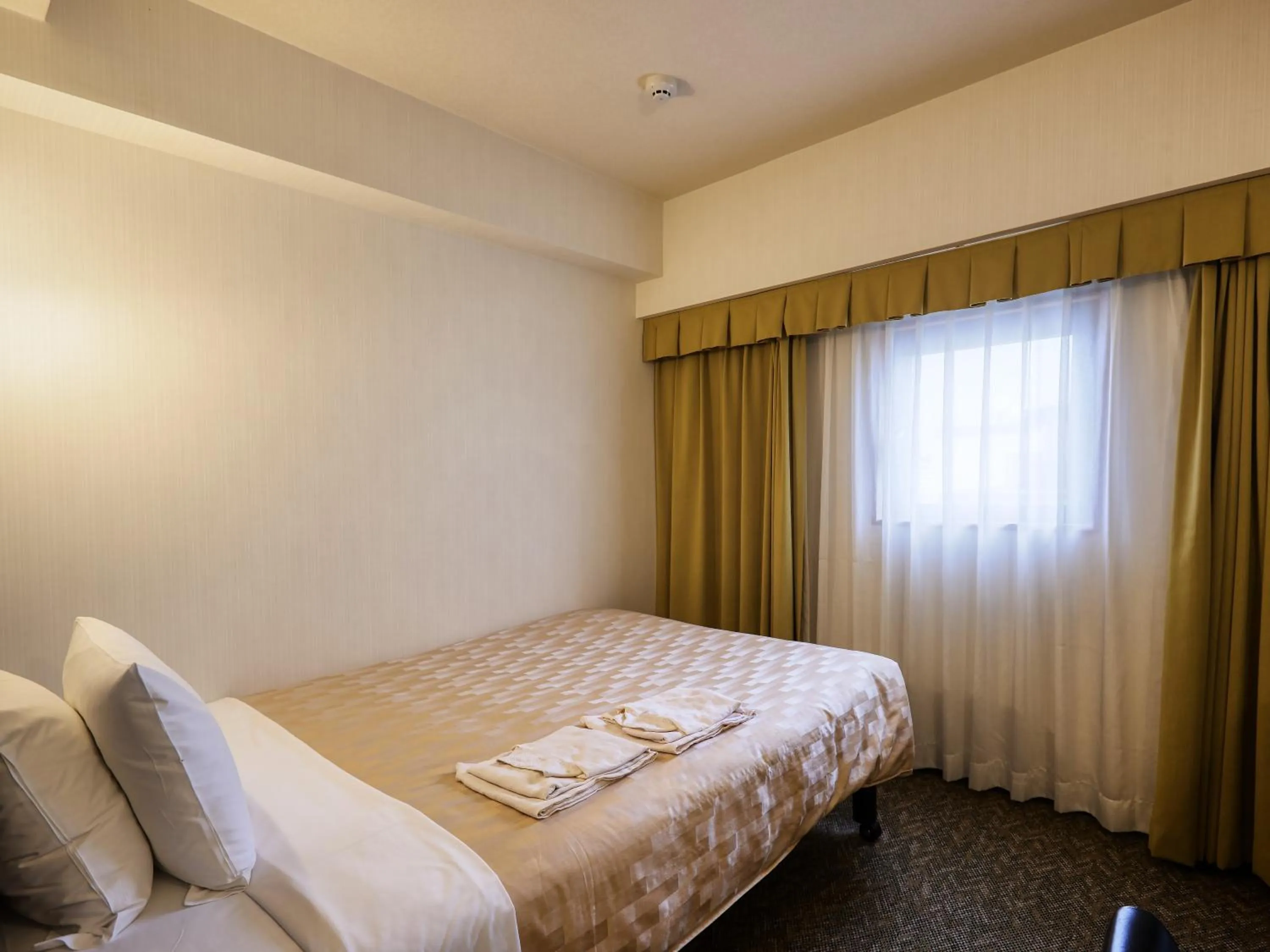 Photo of the whole room, Bed in GRG Hotel Naha
