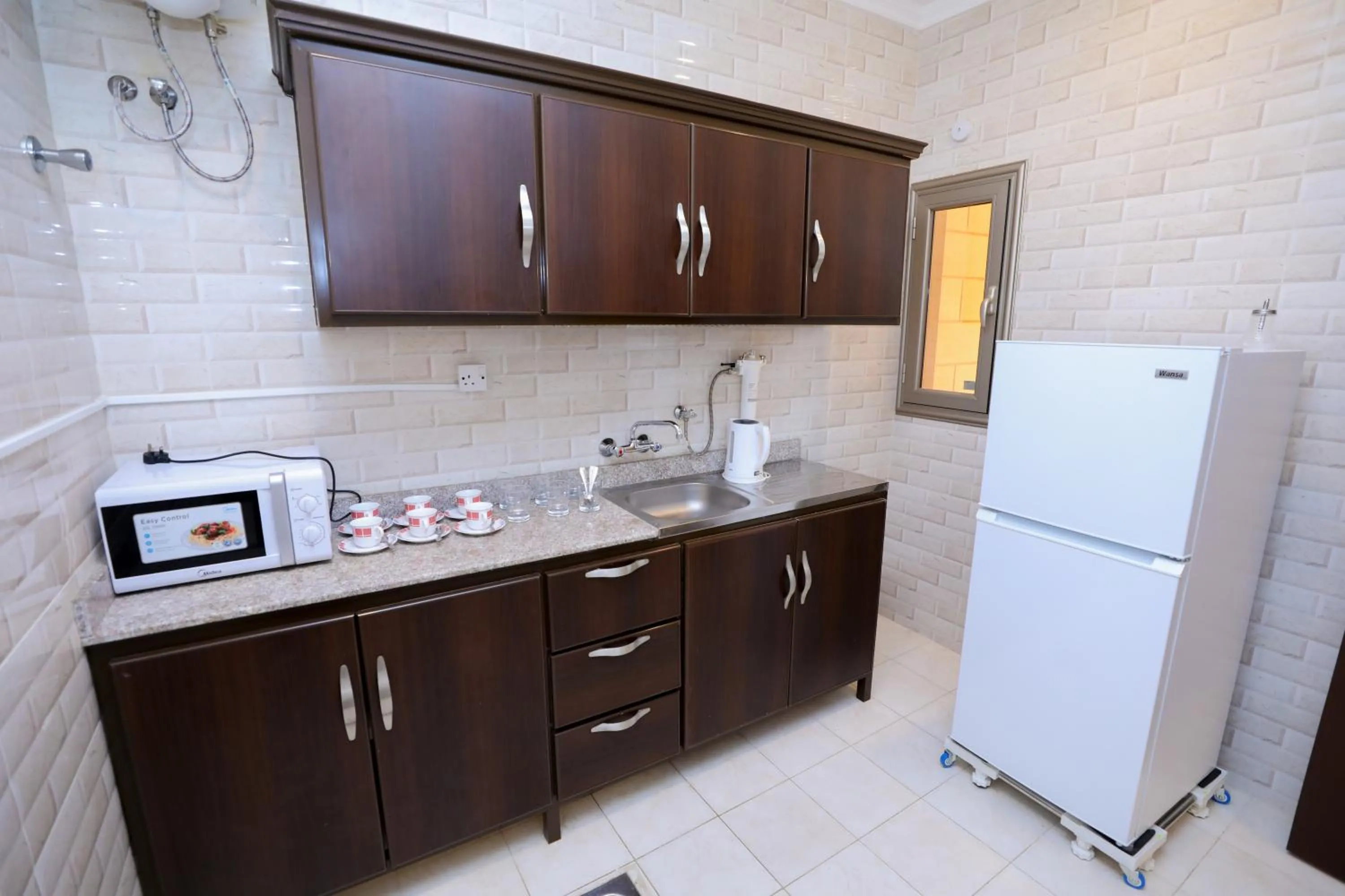 Kitchen or kitchenette, Kitchen/Kitchenette in Magic Suite Al Mahboula