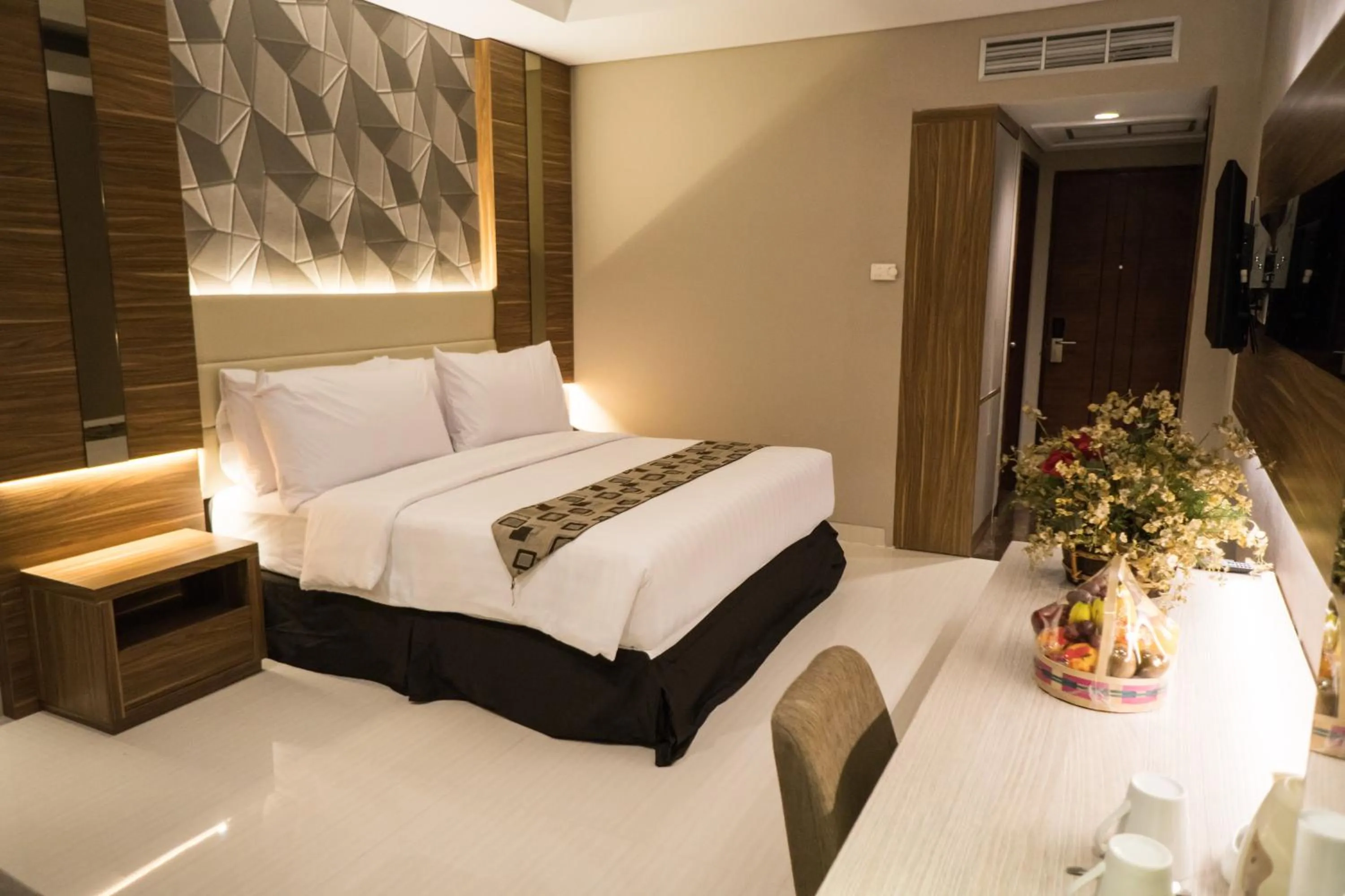 Photo of the whole room, Bed in Novena Hotel Bandung