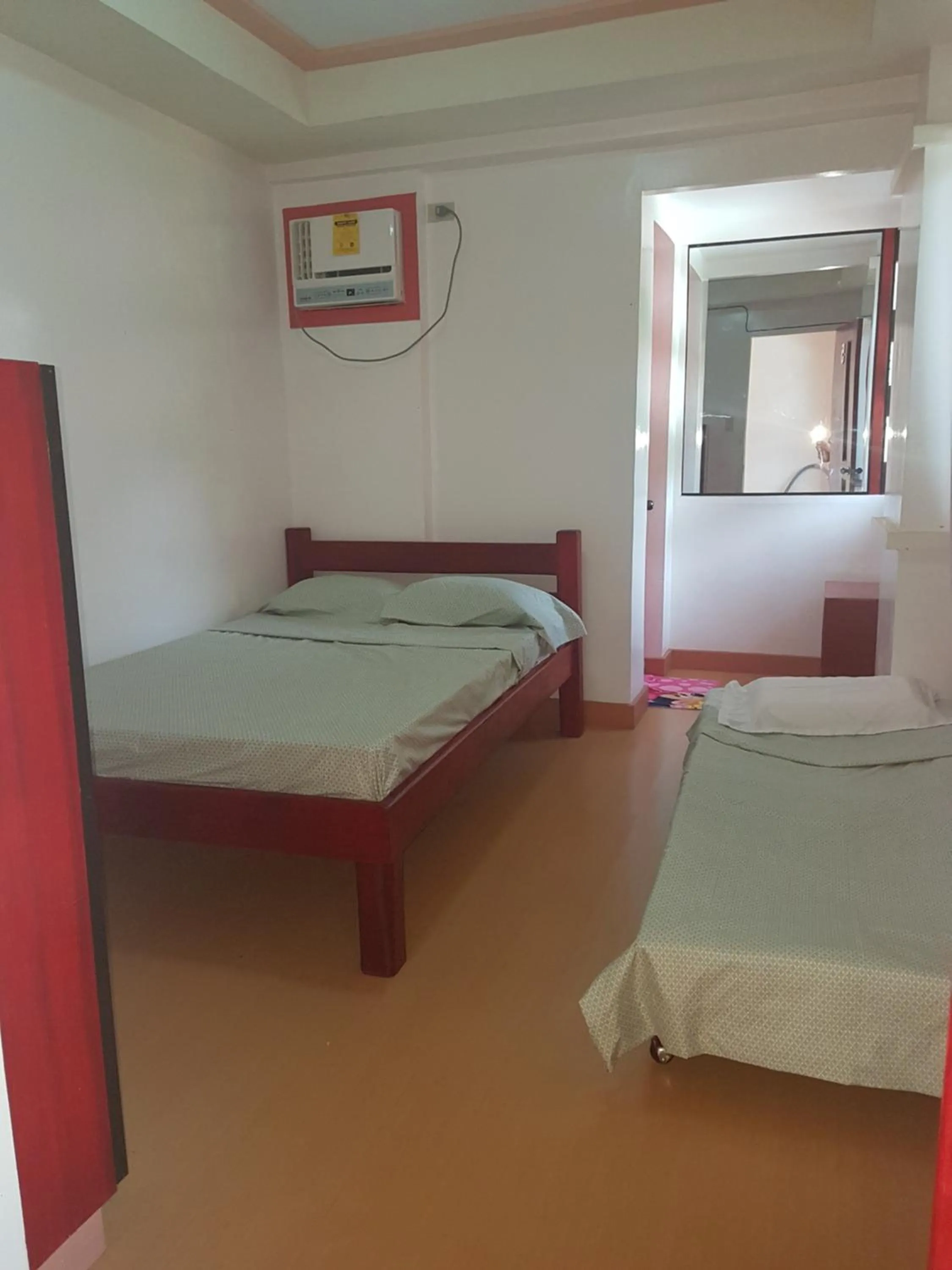 Bed in Catalina`s Inn family room