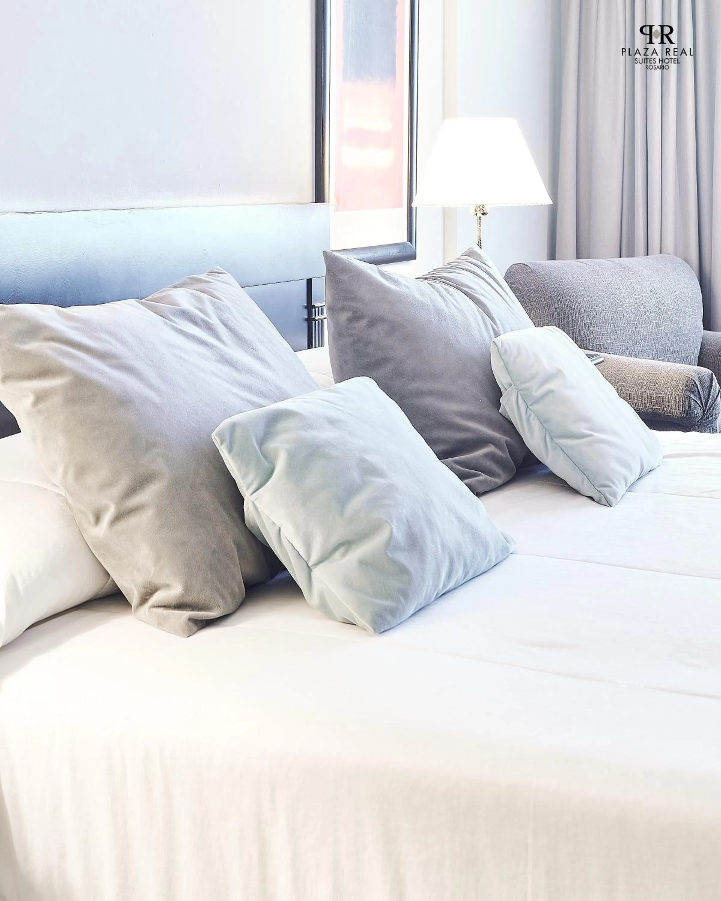 Bed in Plaza Real Suites Hotel