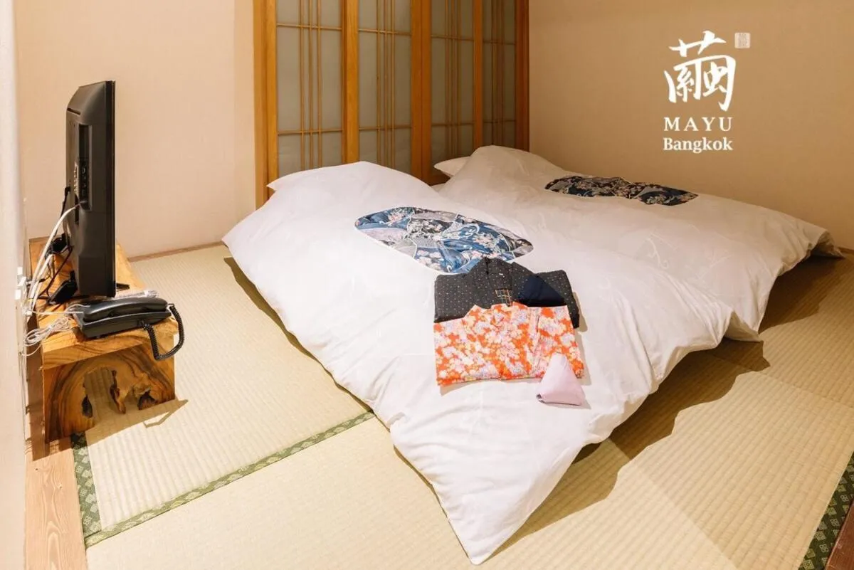 Bed in MAYU Bangkok Japanese Style Hotel