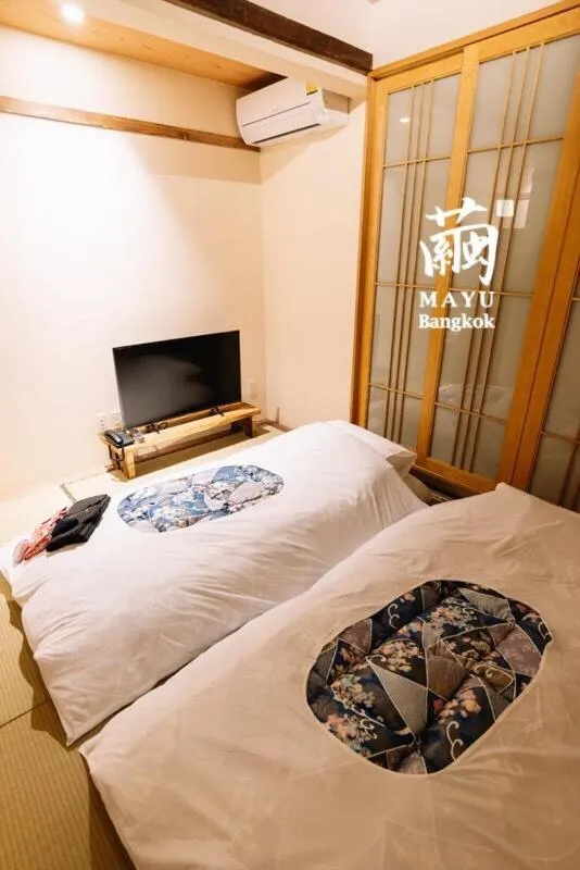 Bed in MAYU Bangkok Japanese Style Hotel