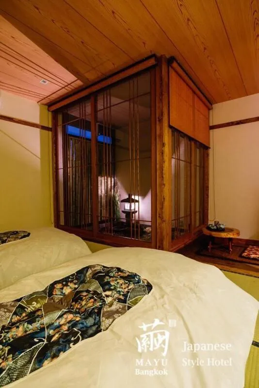 Bed in MAYU Bangkok Japanese Style Hotel