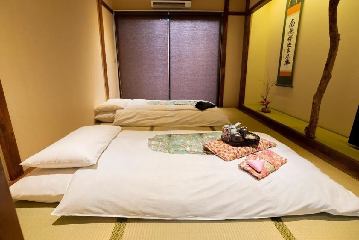 Bed in MAYU Bangkok Japanese Style Hotel