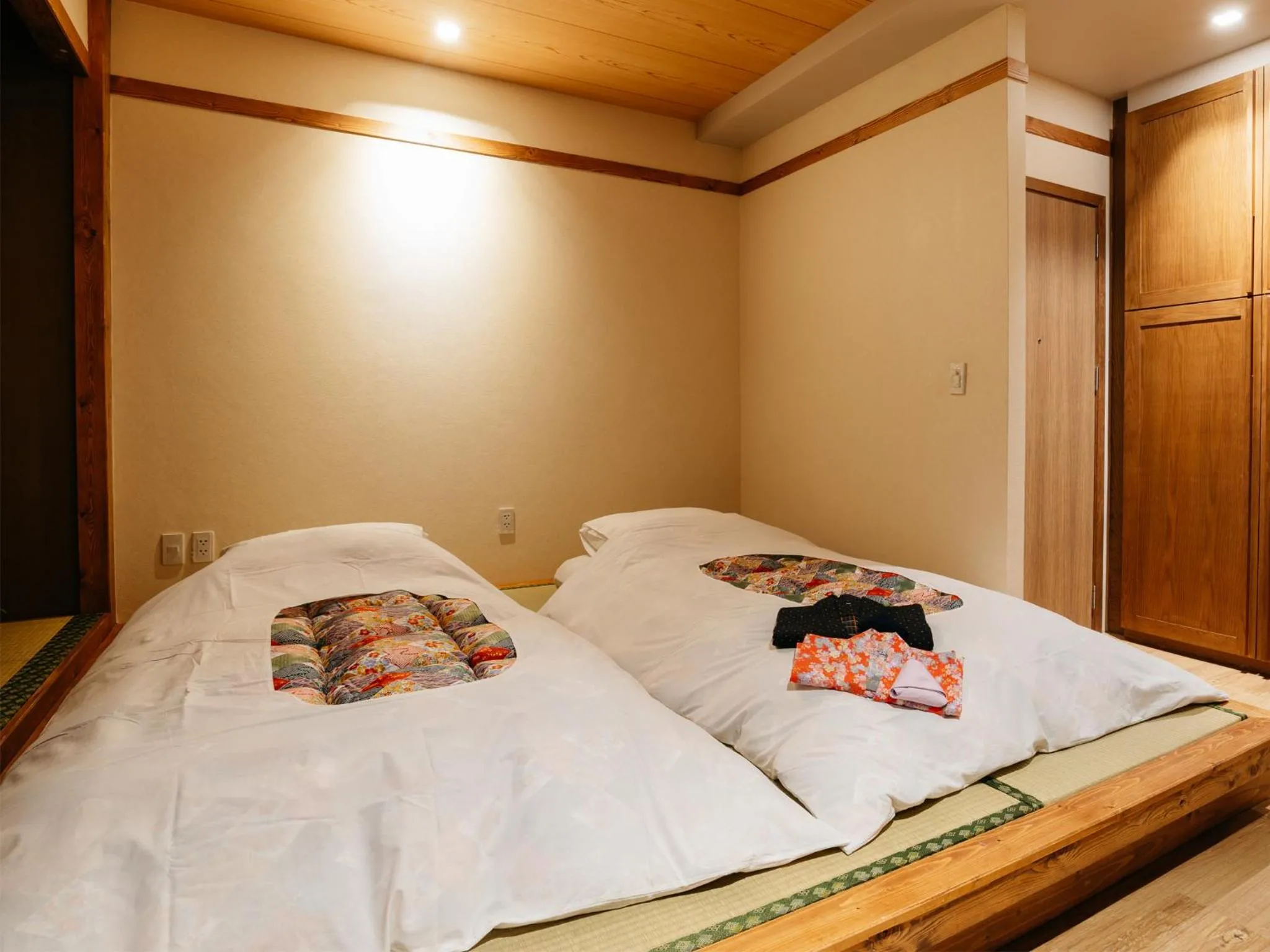 Bed in MAYU Bangkok Japanese Style Hotel