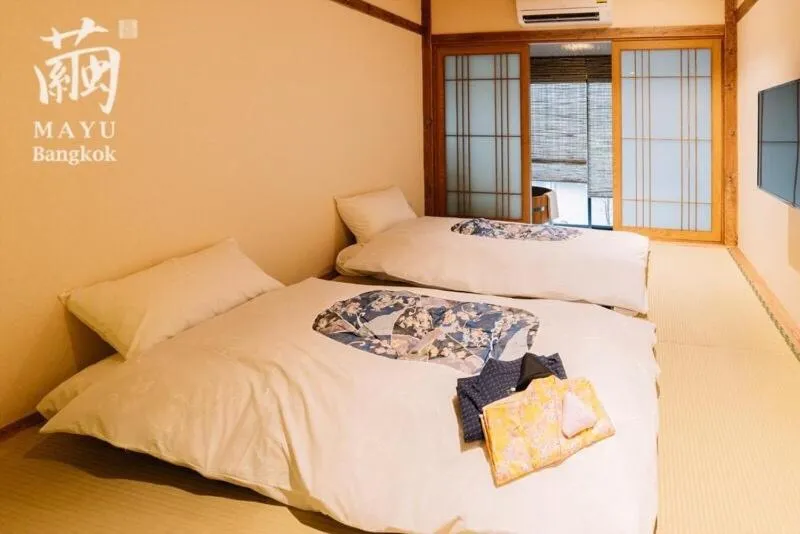 Bed in MAYU Bangkok Japanese Style Hotel