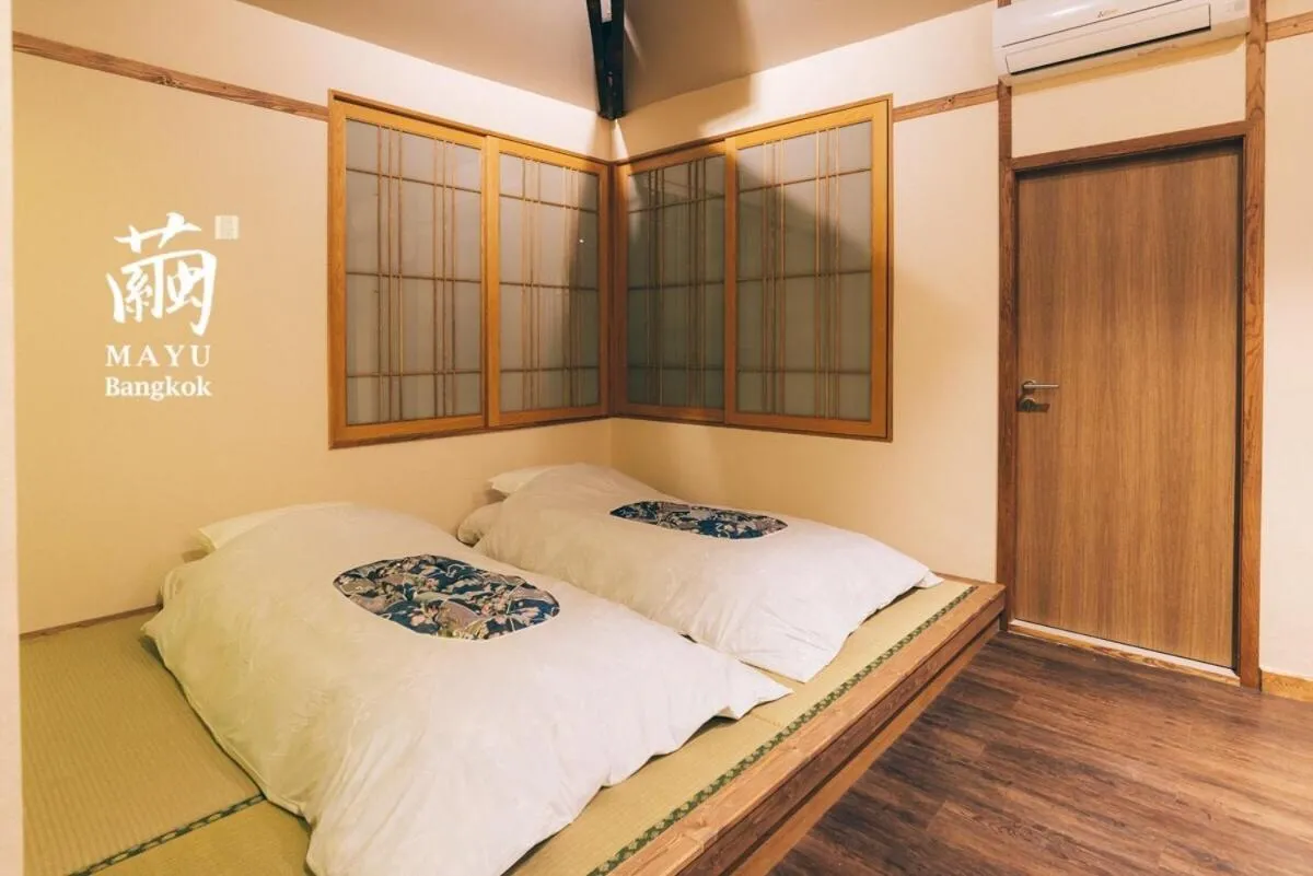 Bed in MAYU Bangkok Japanese Style Hotel