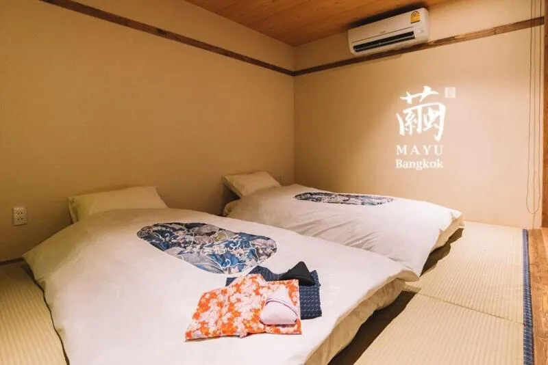 Bed in MAYU Bangkok Japanese Style Hotel