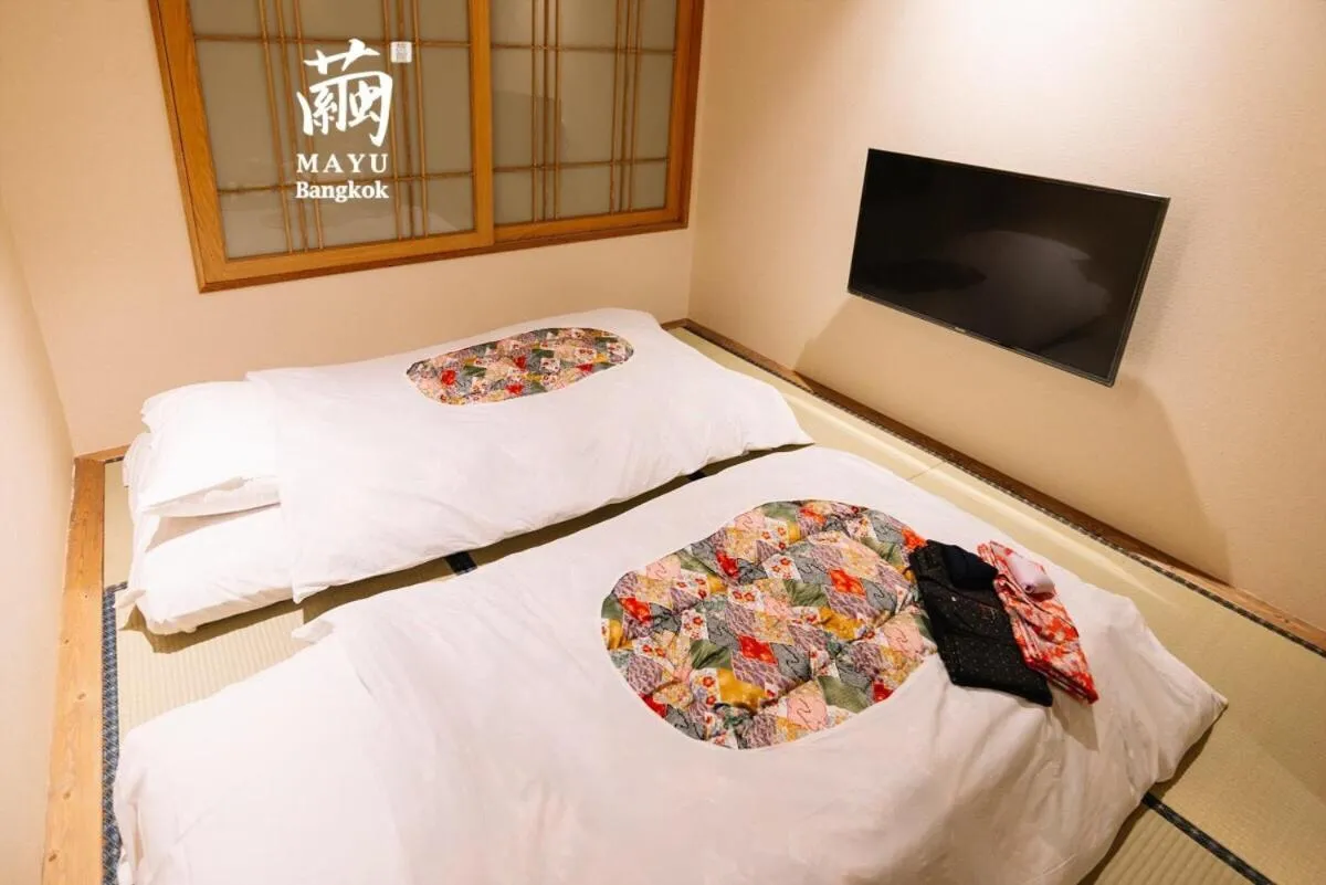 Bed in MAYU Bangkok Japanese Style Hotel