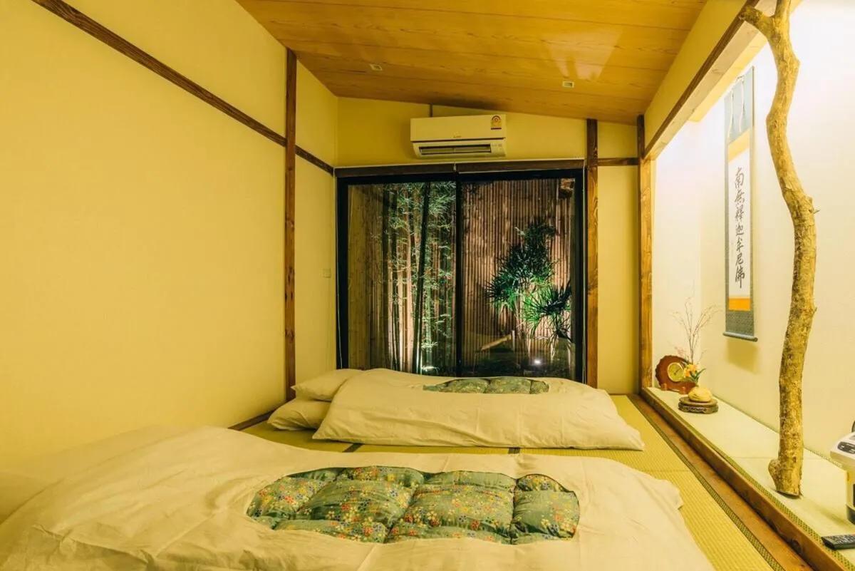 Bed in MAYU Bangkok Japanese Style Hotel