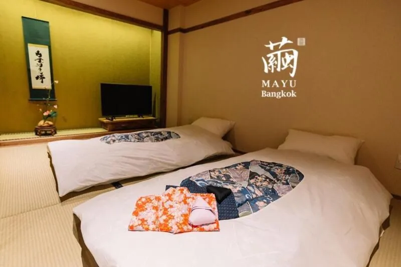 Bed in MAYU Bangkok Japanese Style Hotel