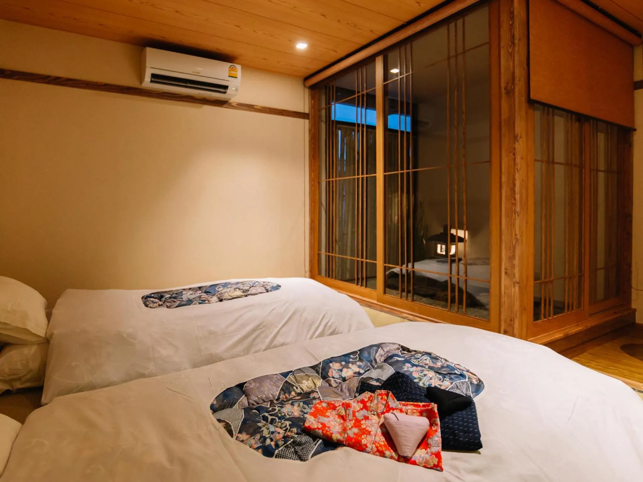Bed in MAYU Bangkok Japanese Style Hotel