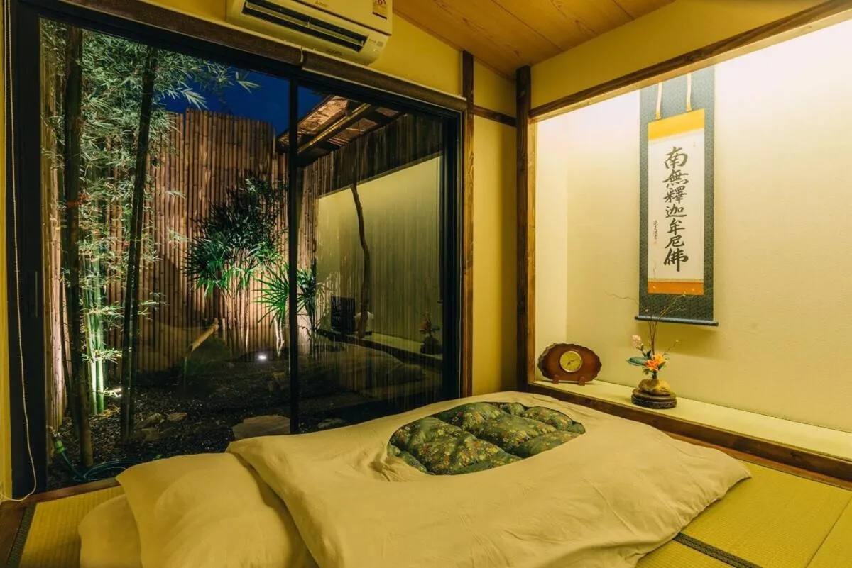 Bed in MAYU Bangkok Japanese Style Hotel