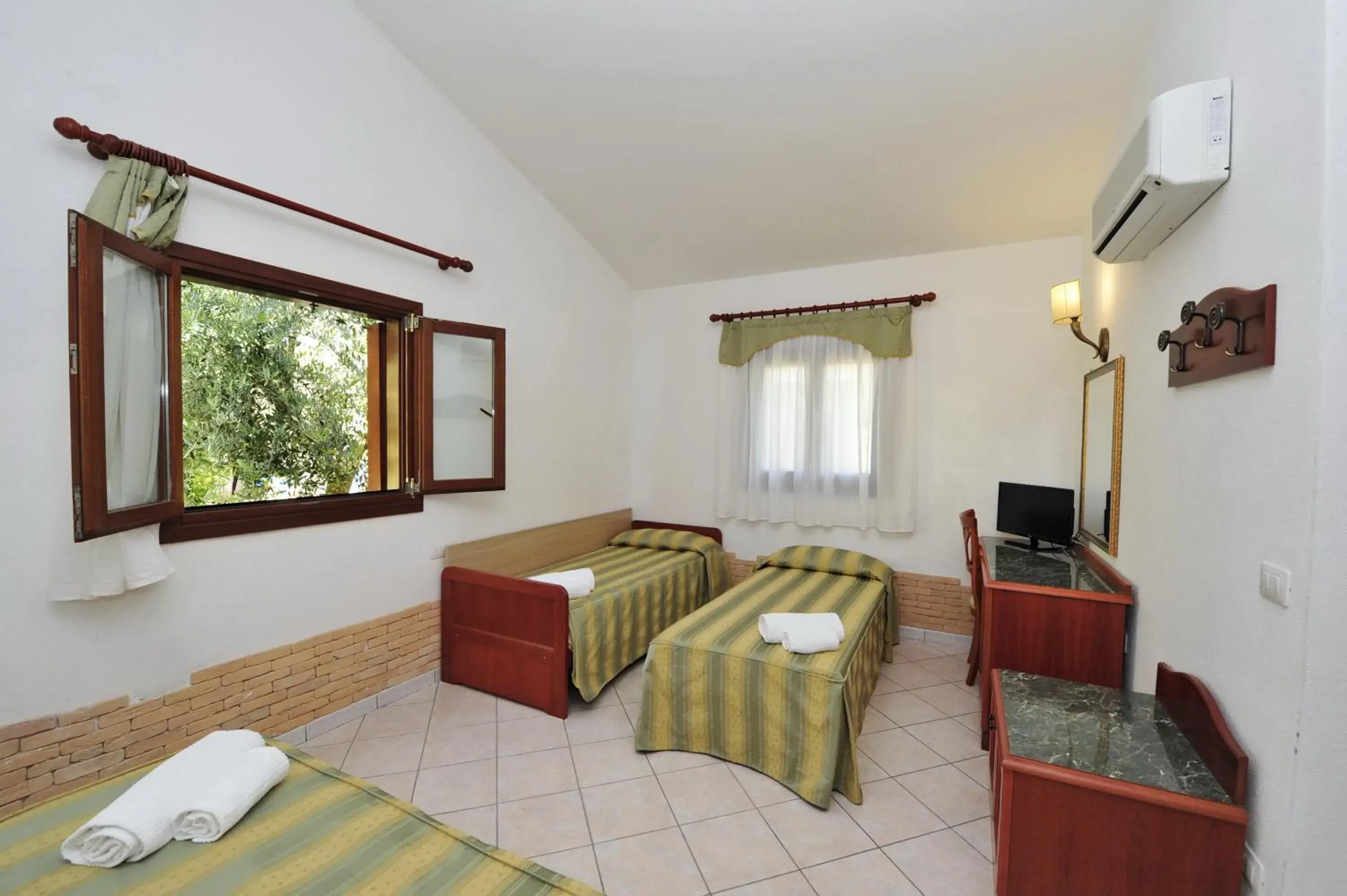 Photo of the whole room, Bed in Hotel Cala Mirto Photo of the whole room, Bed in Hotel Cala Mirto