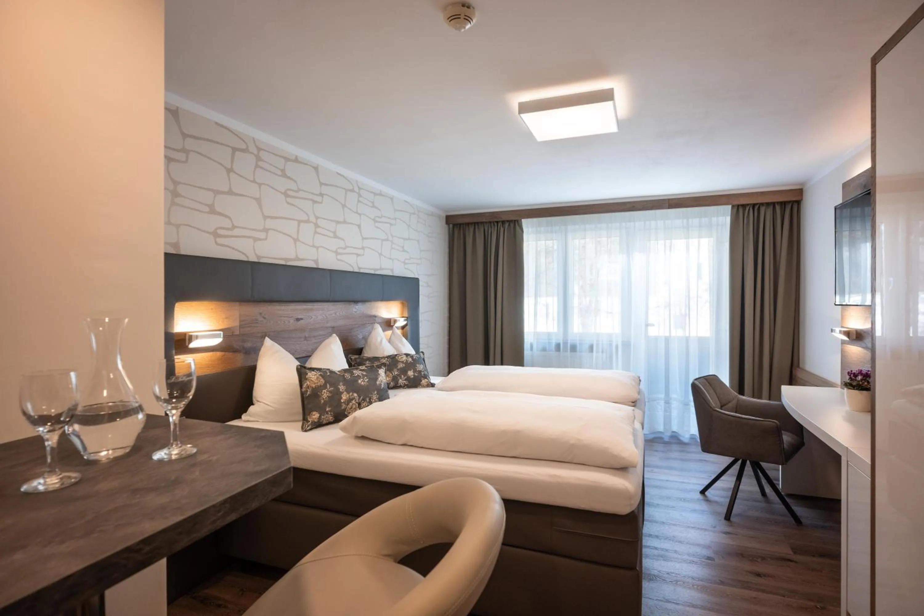 Photo of the whole room, Bed in Hotel Baumgarten & Chalet Baumgarten