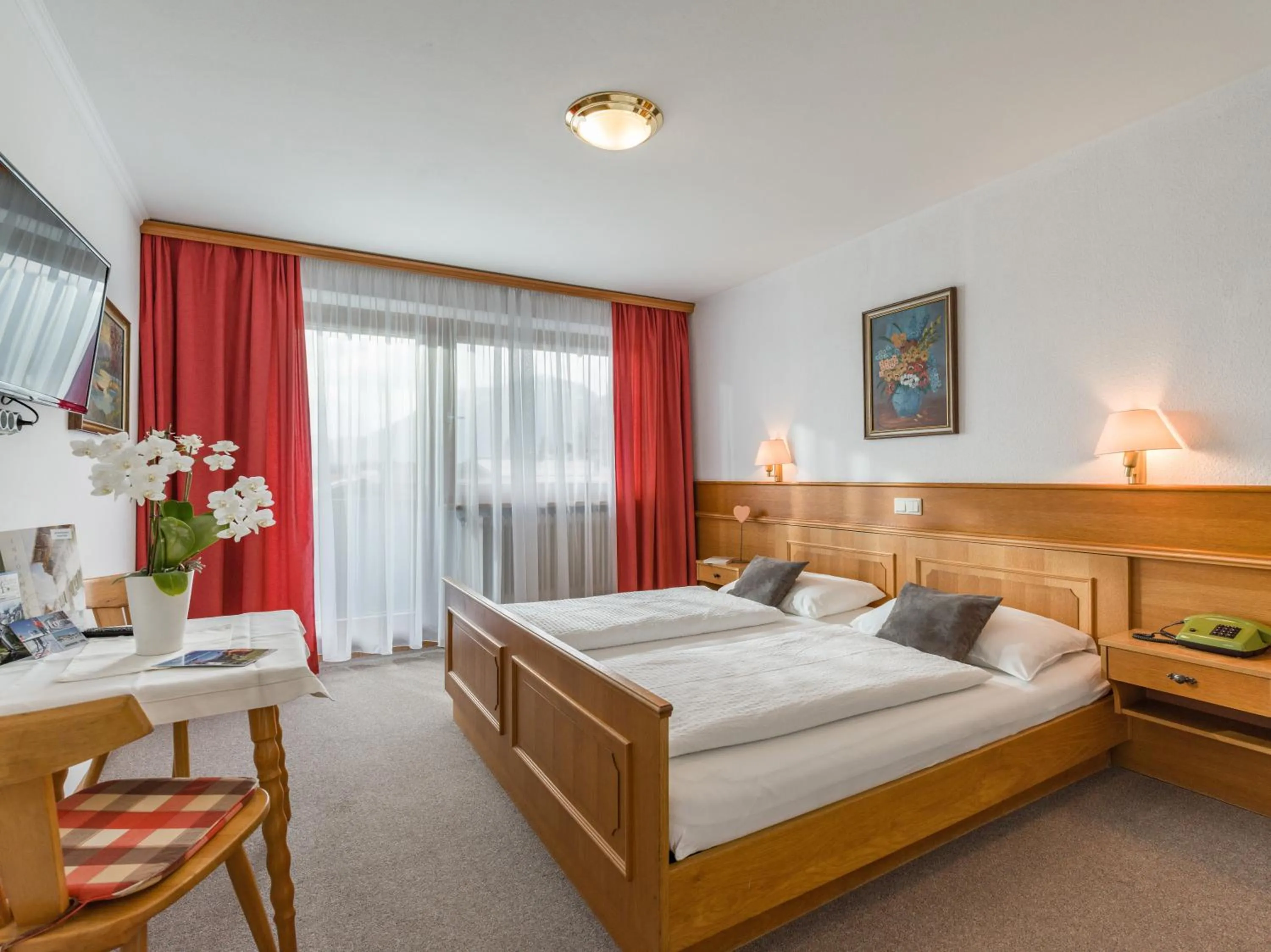 Photo of the whole room, Bed in Hotel Baumgarten & Chalet Baumgarten