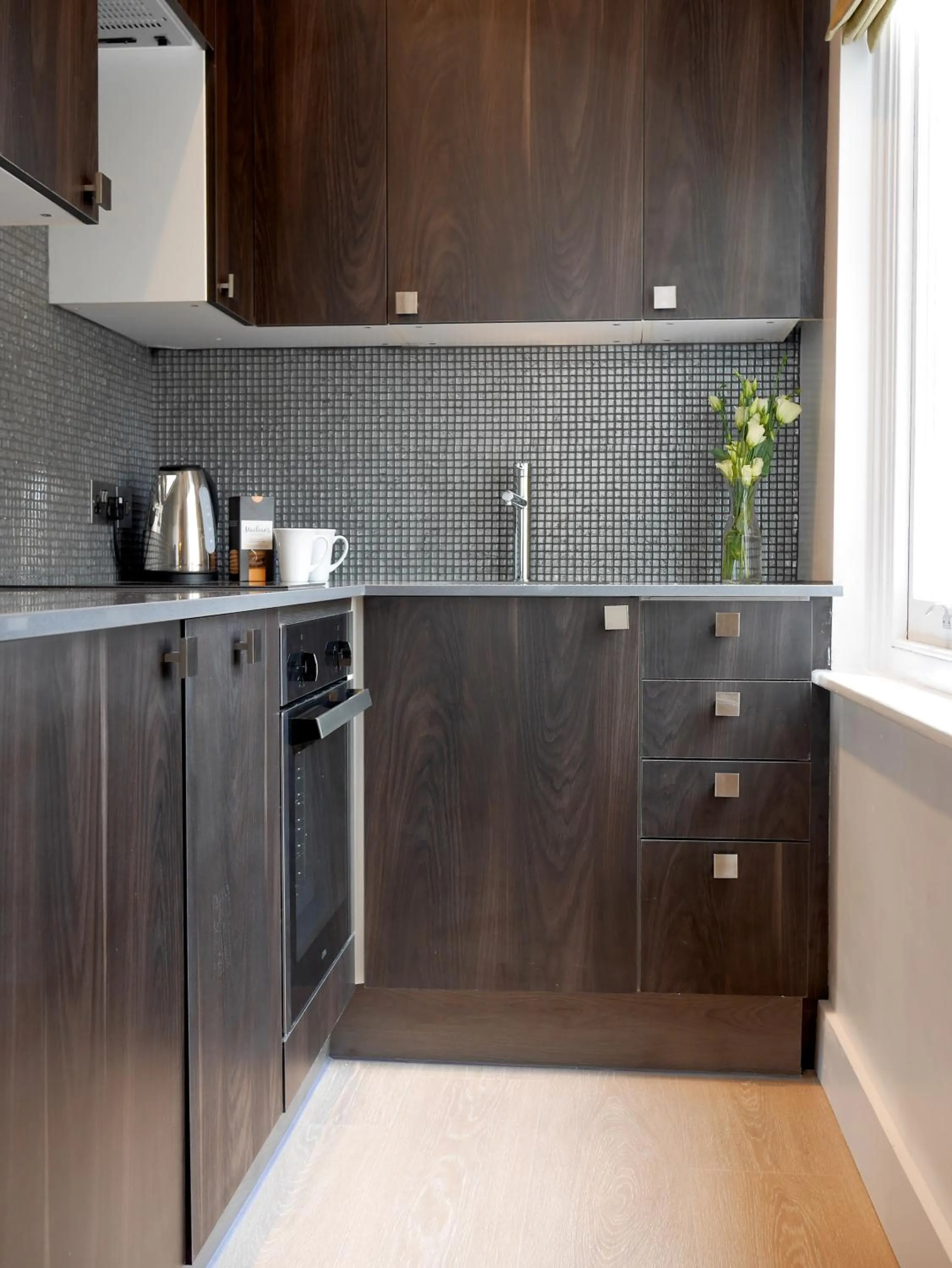 Kitchen or kitchenette in Nevern Place by Supercity Aparthotels