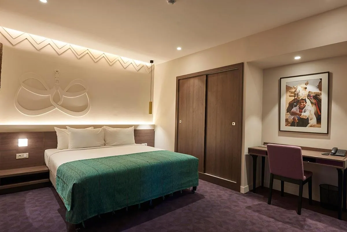 Bed in M Suite Hotel