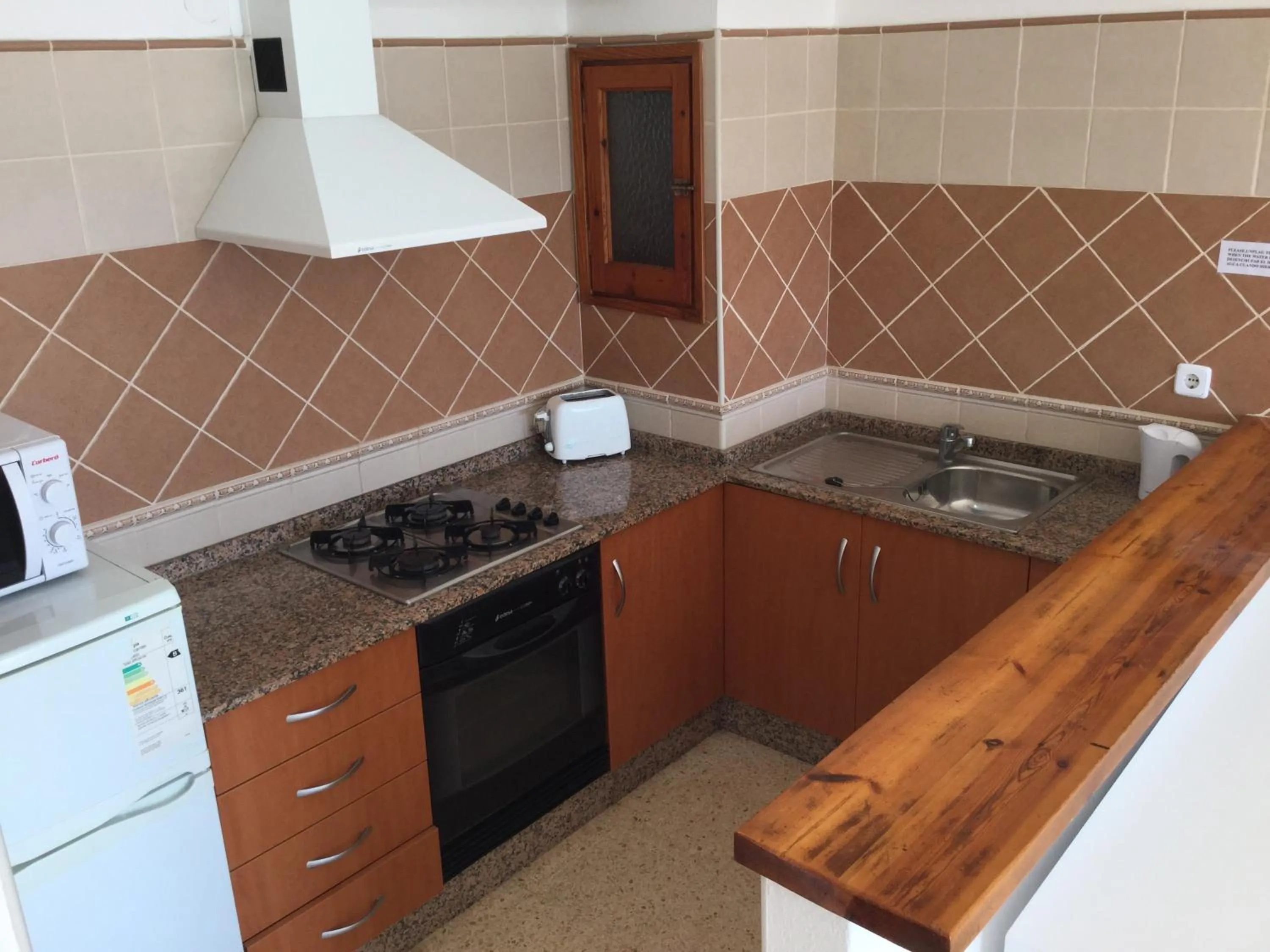 Kitchen or kitchenette in Apartamentos Alba