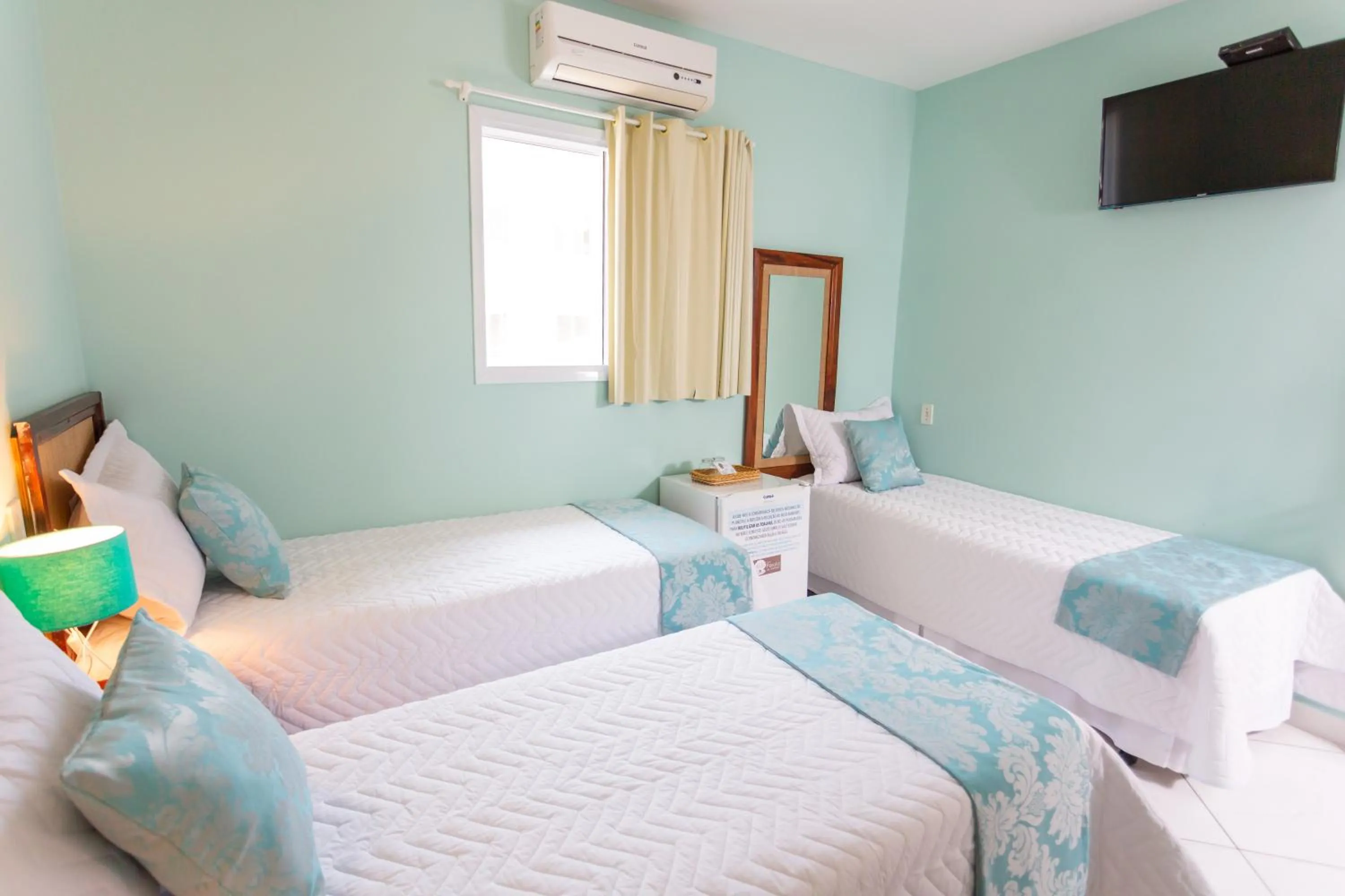 Bed in Pousada Pérola de Ubatuba