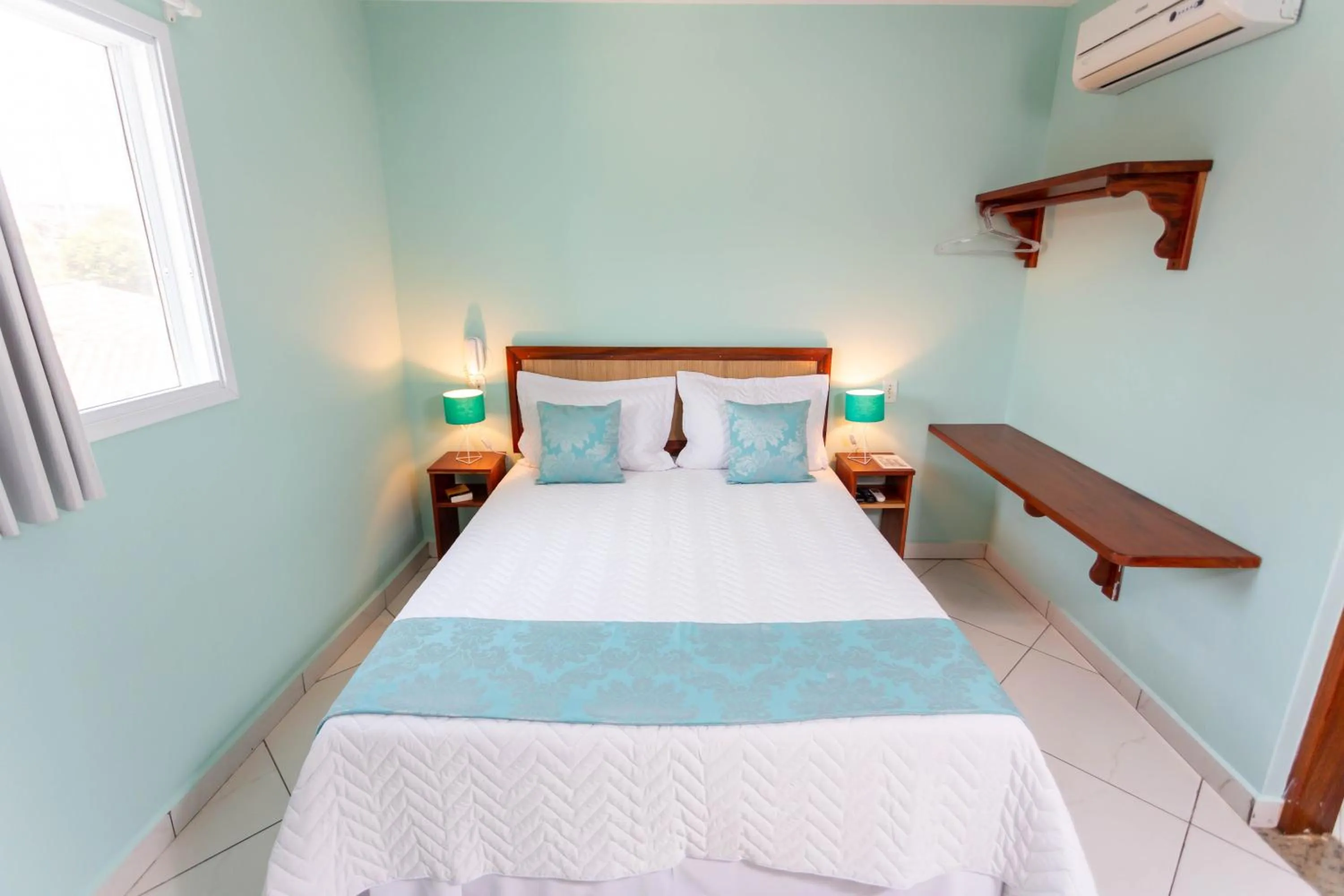 Bed in Pousada Pérola de Ubatuba