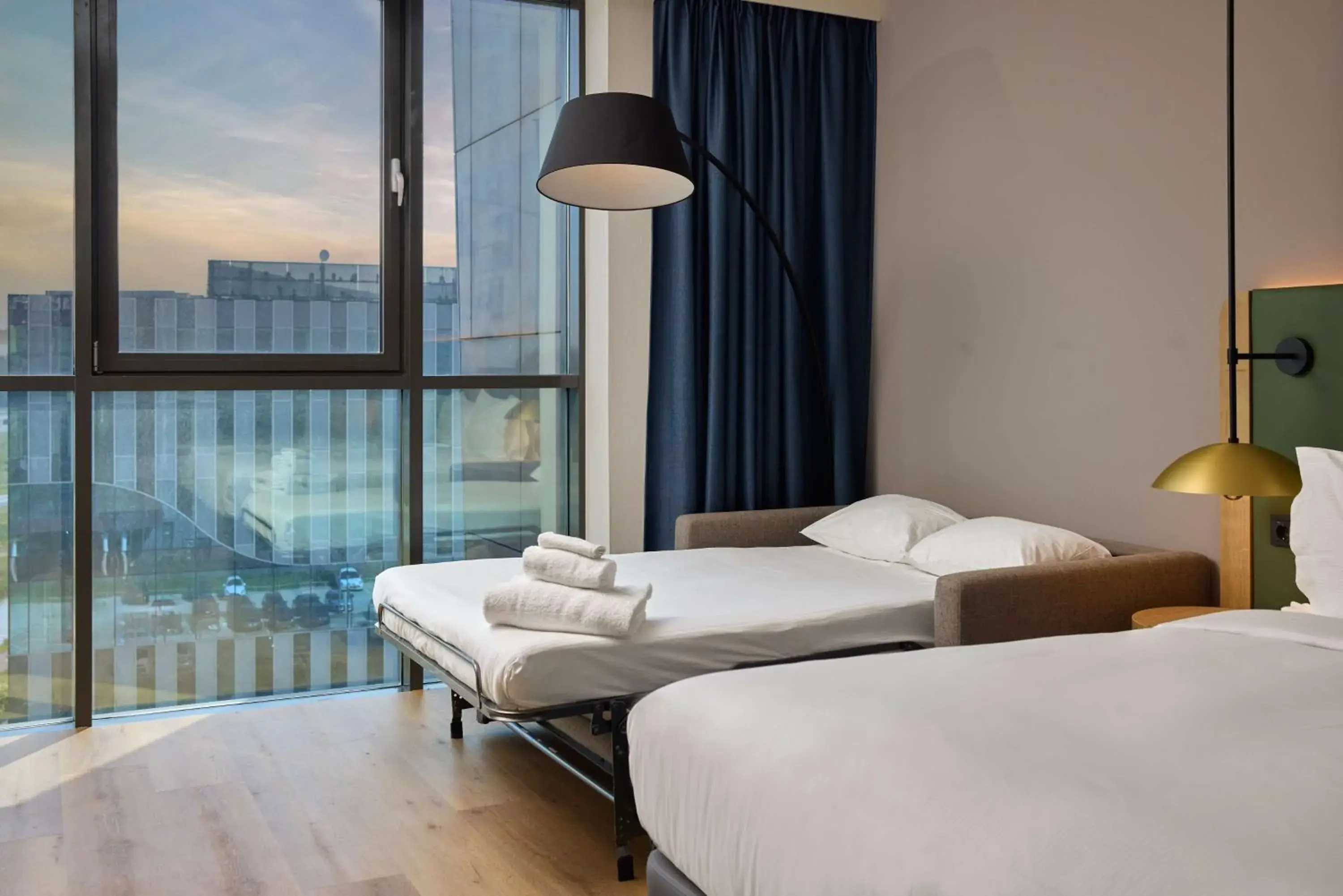 Deluxe Queen Room with Two Queen Beds and Sofa Bed in Hilton Garden Inn Leiden Deluxe Queen Room with Two Queen Beds and Sofa Bed in Hilton Garden Inn Leiden