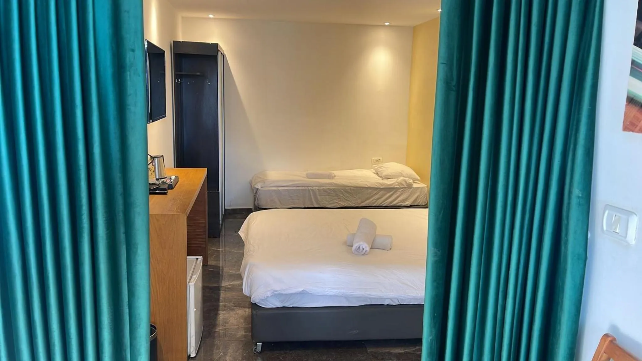 Bed in Lago Suites Hotel