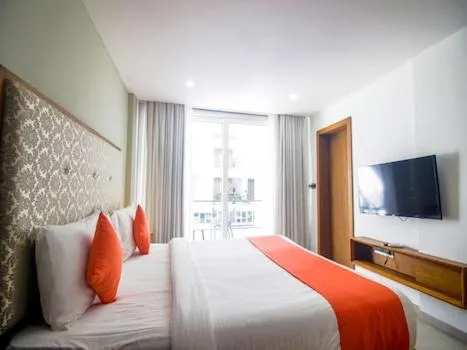 Communal lounge/ TV room, Bed in Okean De Goa Vagator