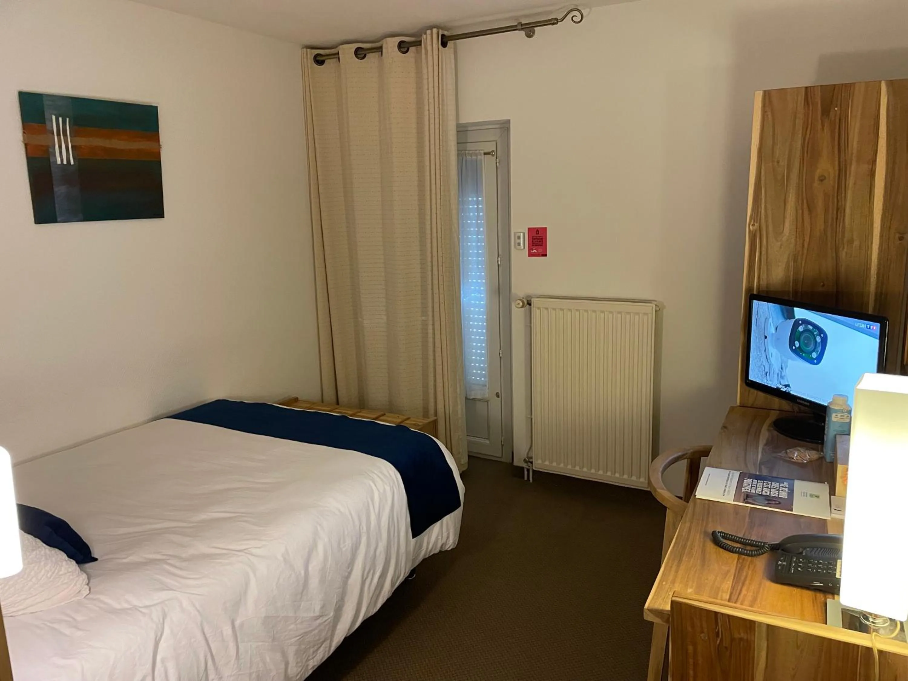 Photo of the whole room, Bed in Logis Hôtel de France & Restaurant Pamiers