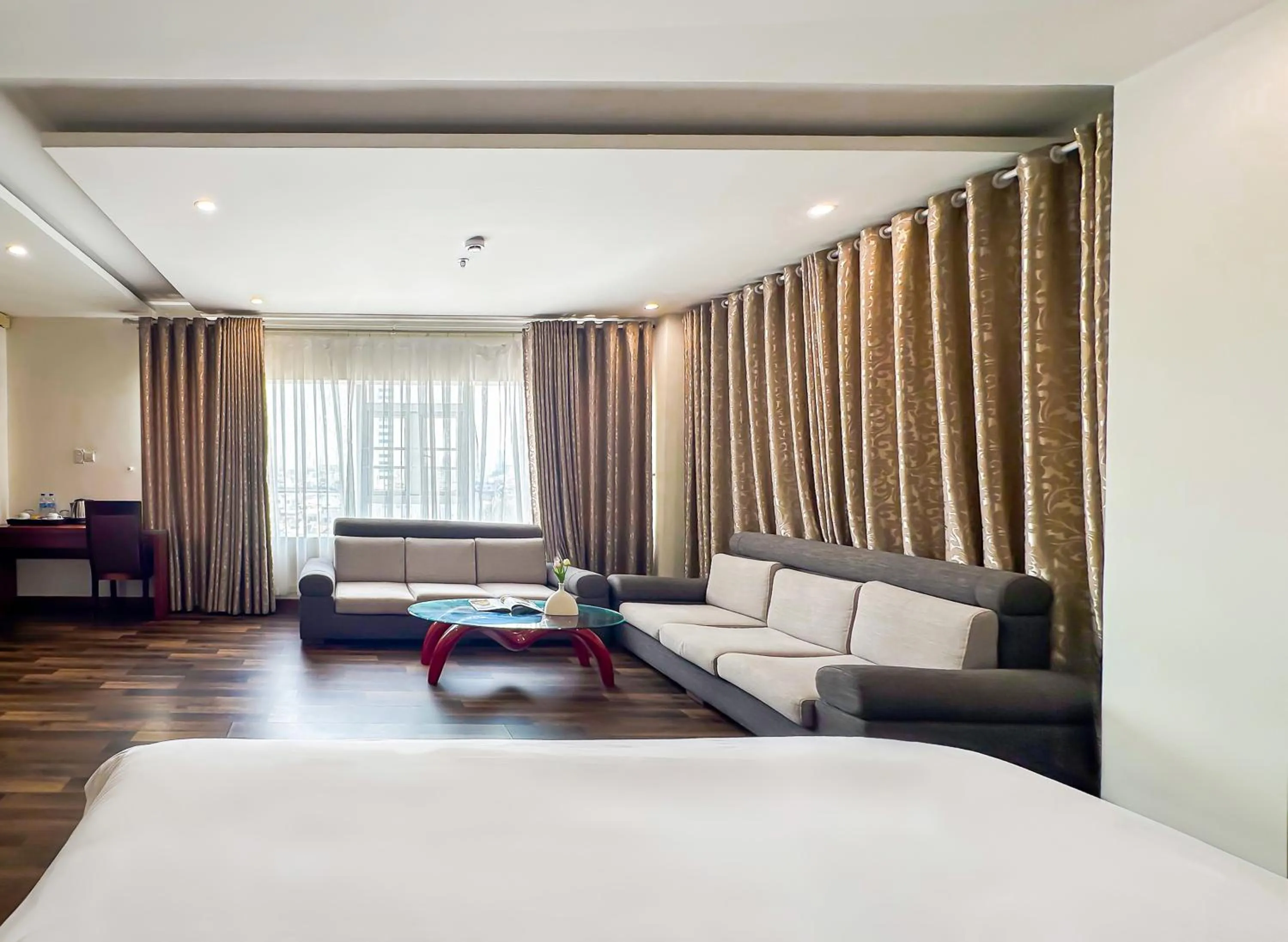 Seating area, Bed in Quoc Cuong Center Da Nang Hotel by Haviland