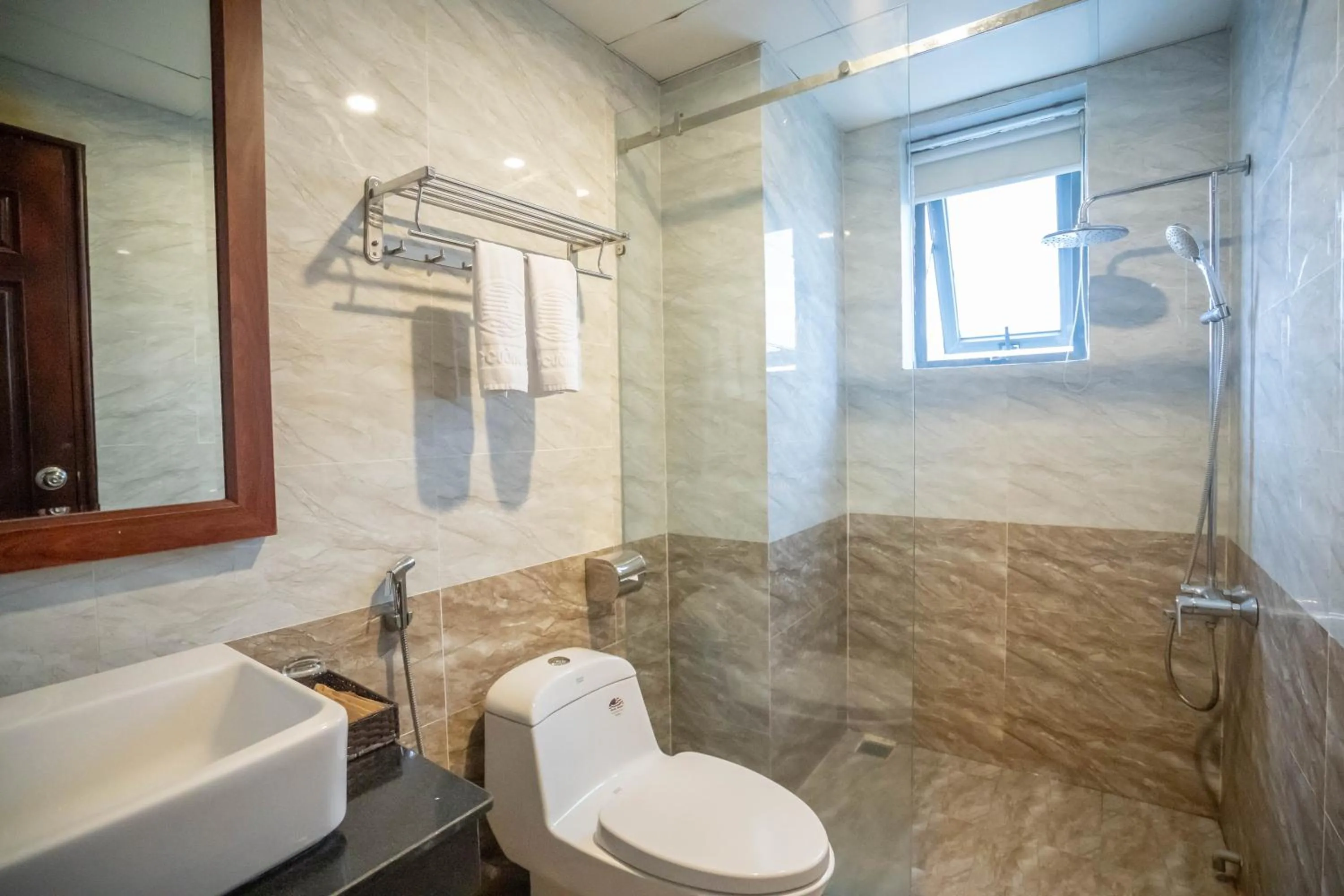 Toilet in Quoc Cuong Center Da Nang Hotel by Haviland