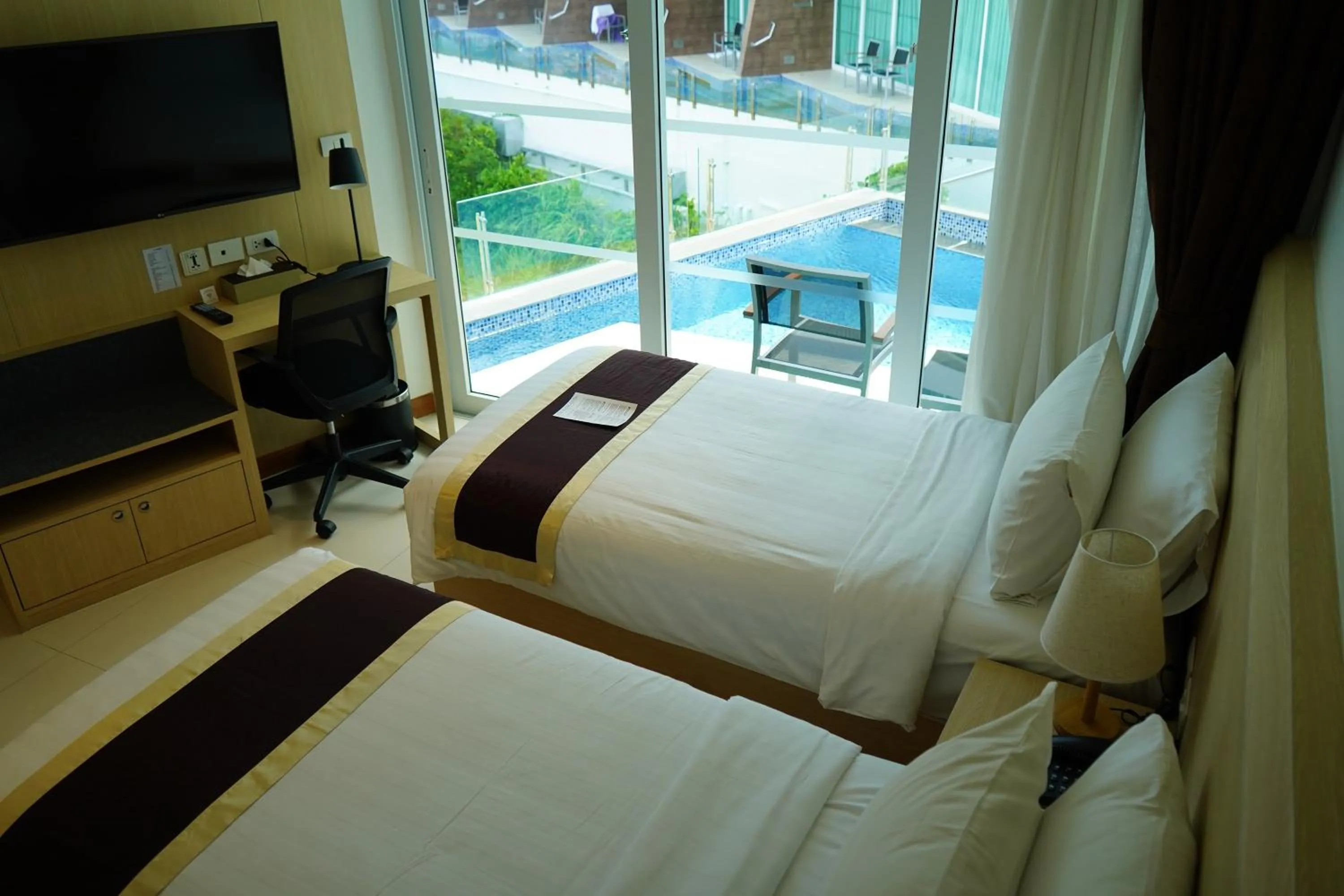 Bedroom in The Beachfront Hotel Phuket