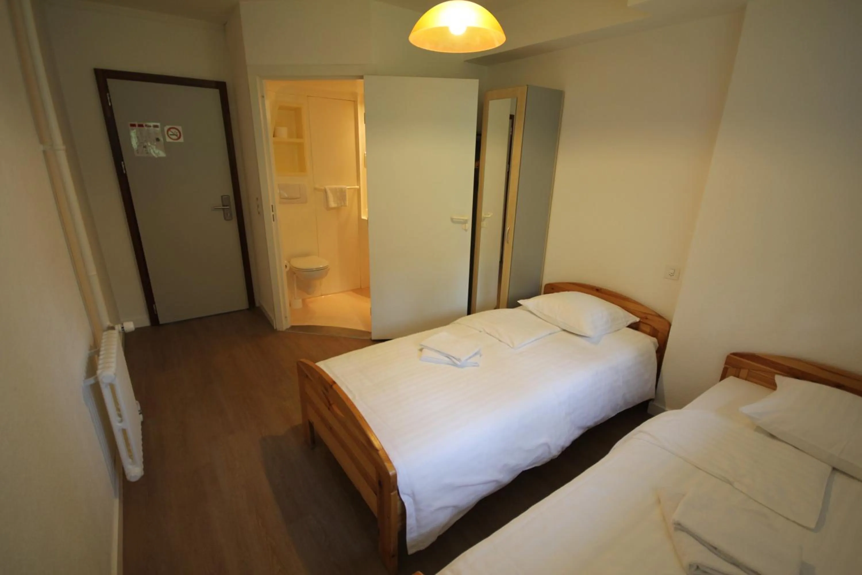 Toilet, Bed in Hotel Abaca