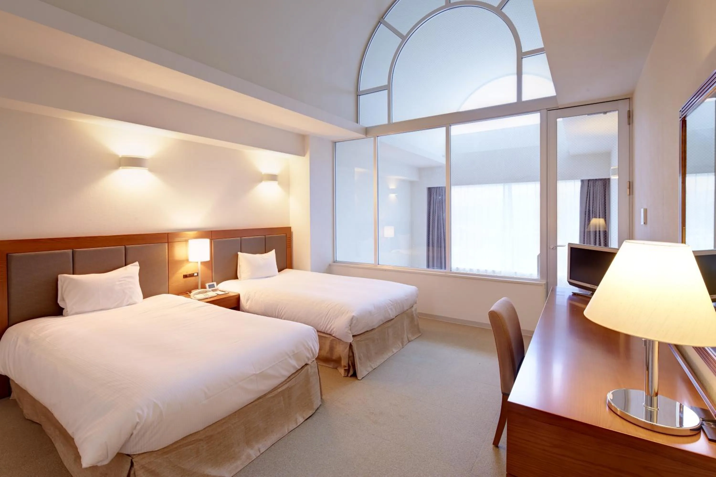 Bed in Hotel Mahaina Wellness Resorts Okinawa