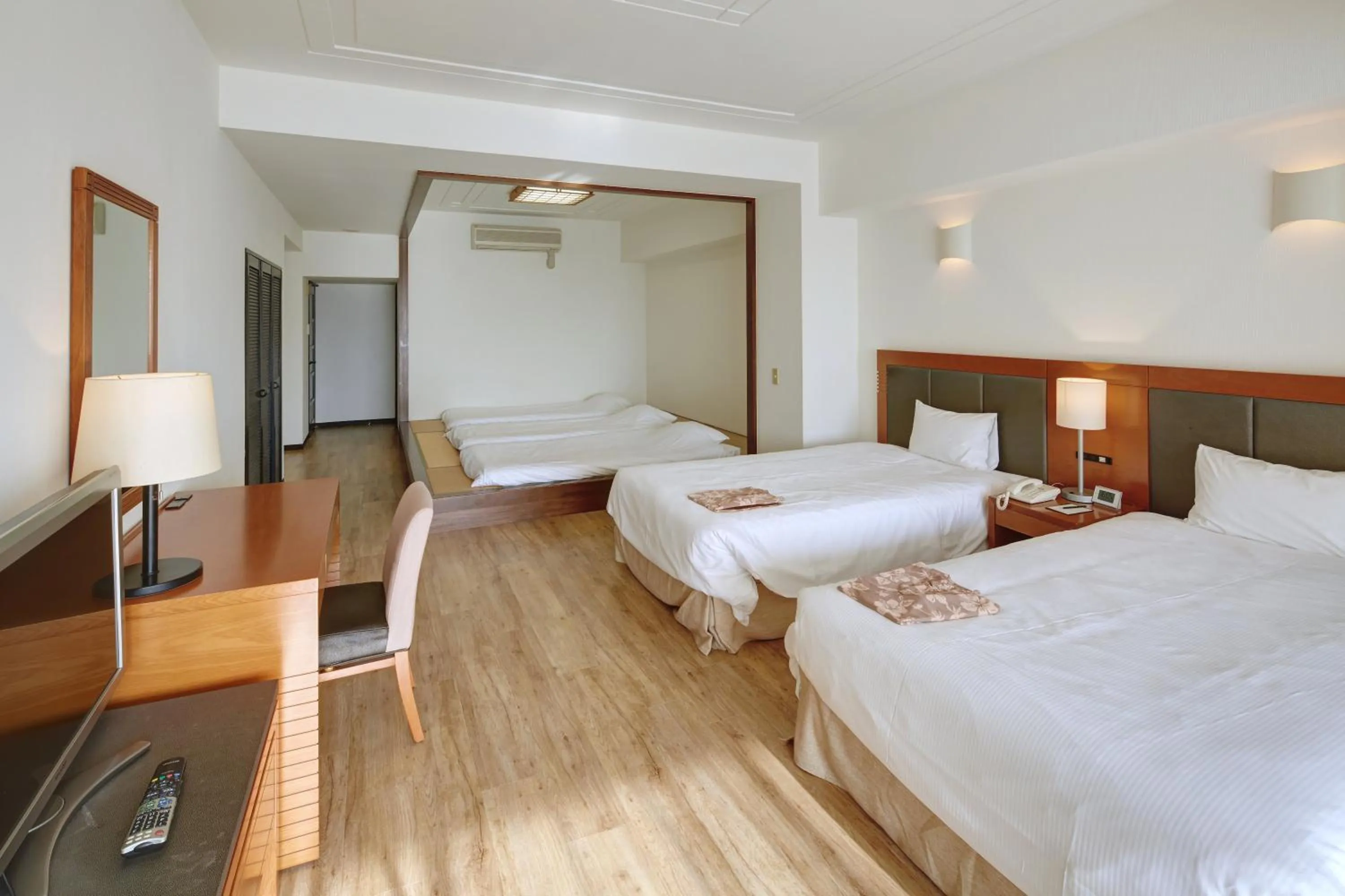 Photo of the whole room, Bed in Hotel Mahaina Wellness Resorts Okinawa