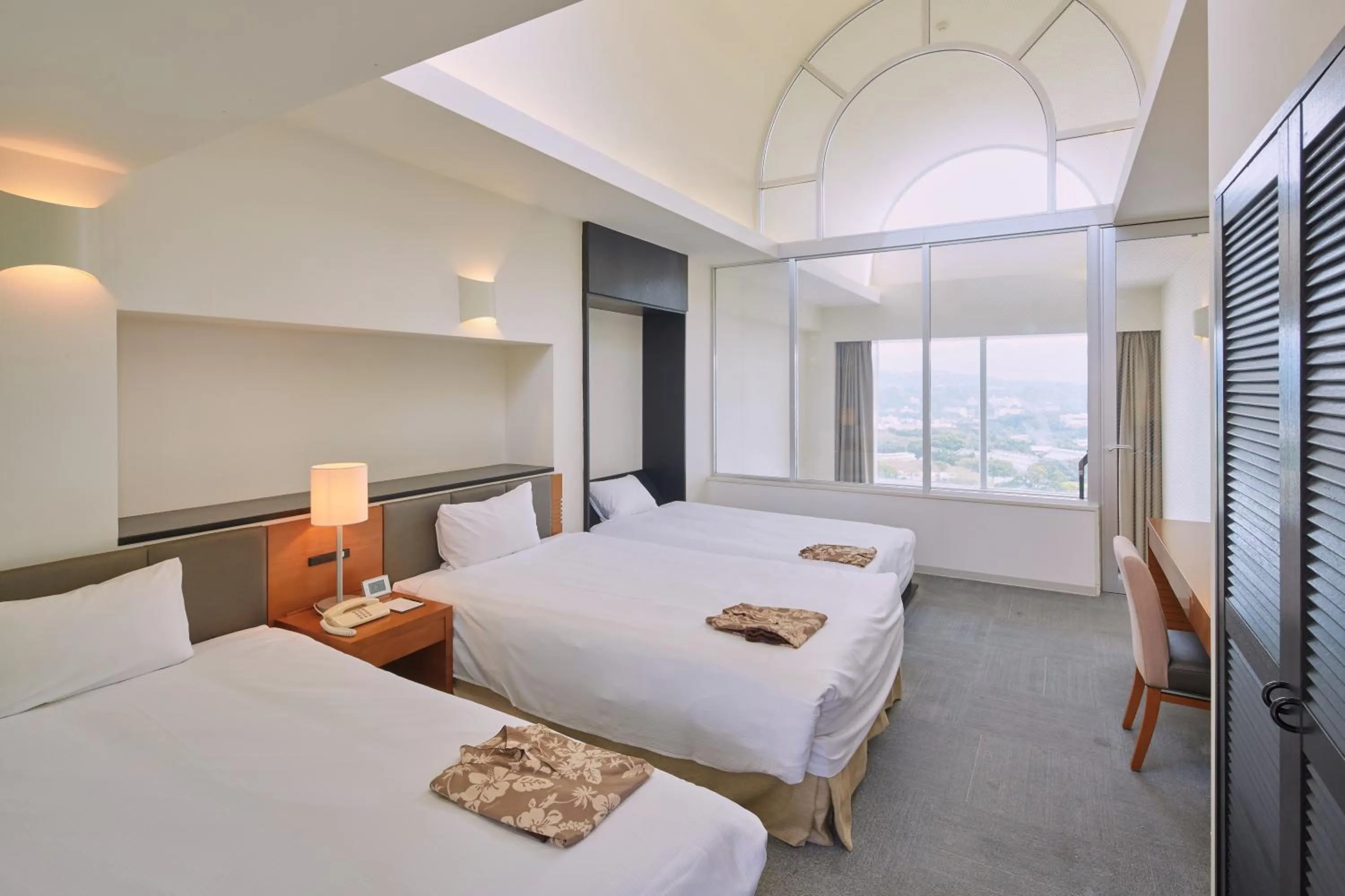 Bed in Hotel Mahaina Wellness Resorts Okinawa