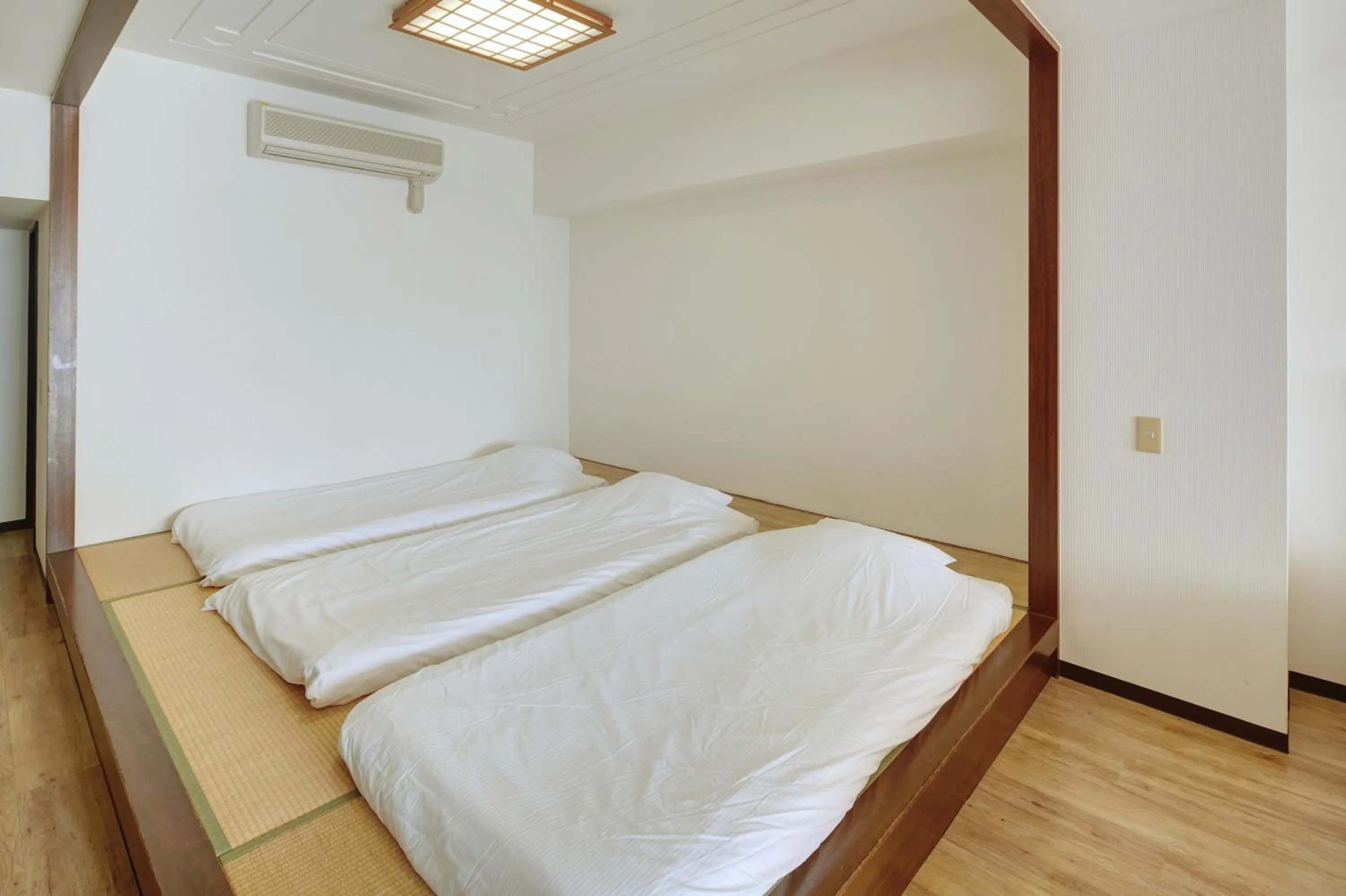 Photo of the whole room, Bed in Hotel Mahaina Wellness Resorts Okinawa