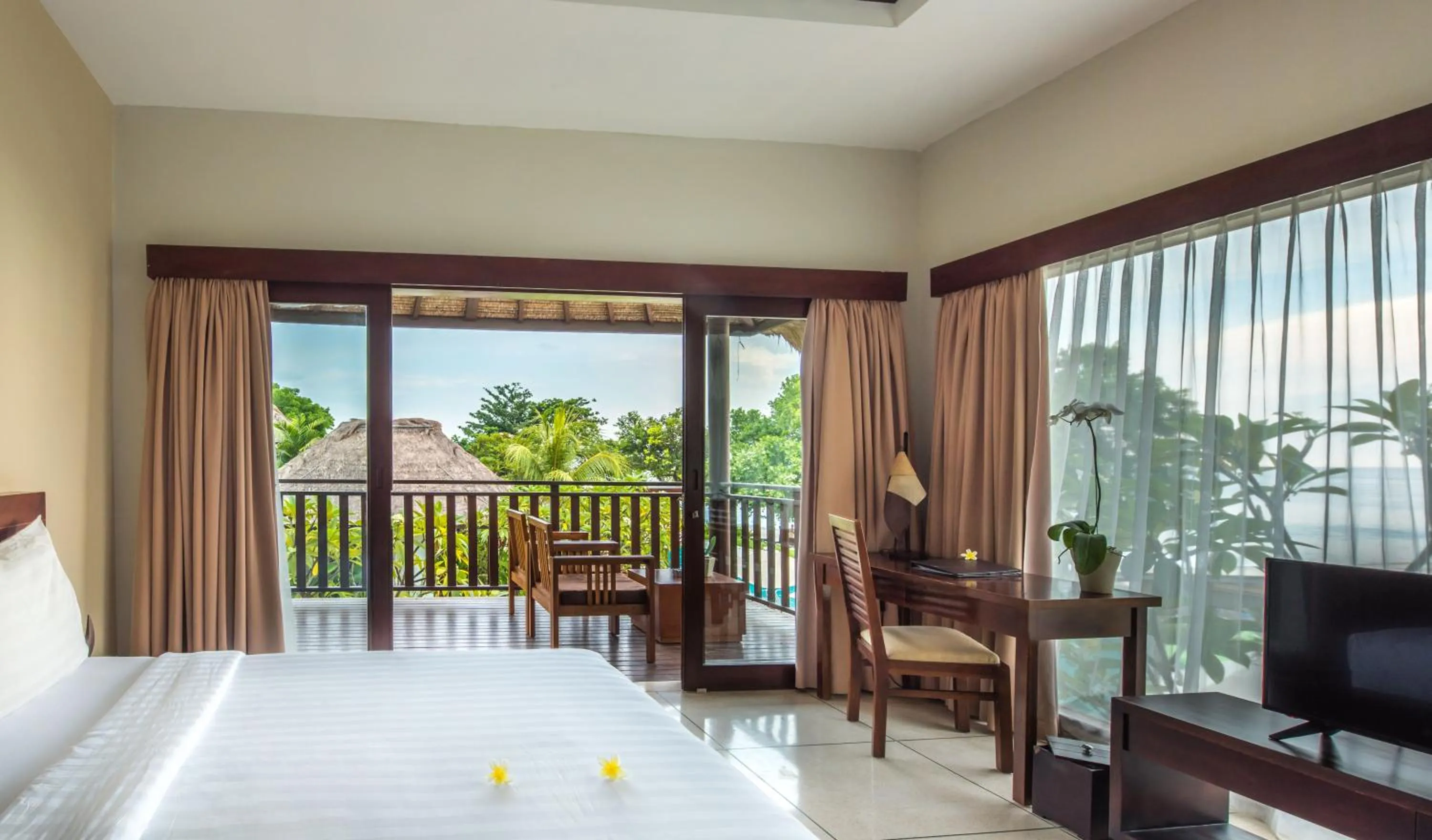 Bed in Living Asia Resort and Spa