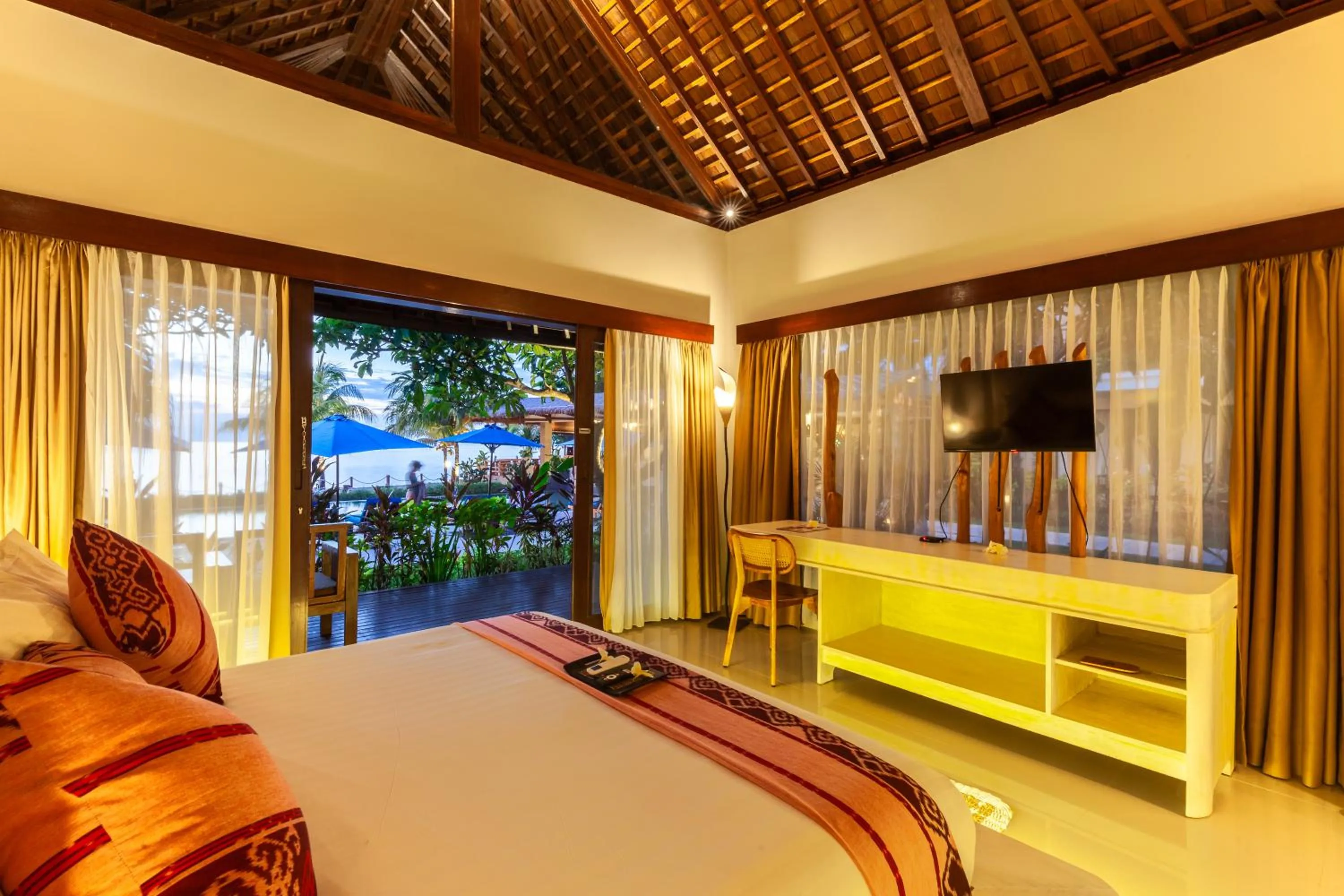 Bed in Living Asia Resort and Spa