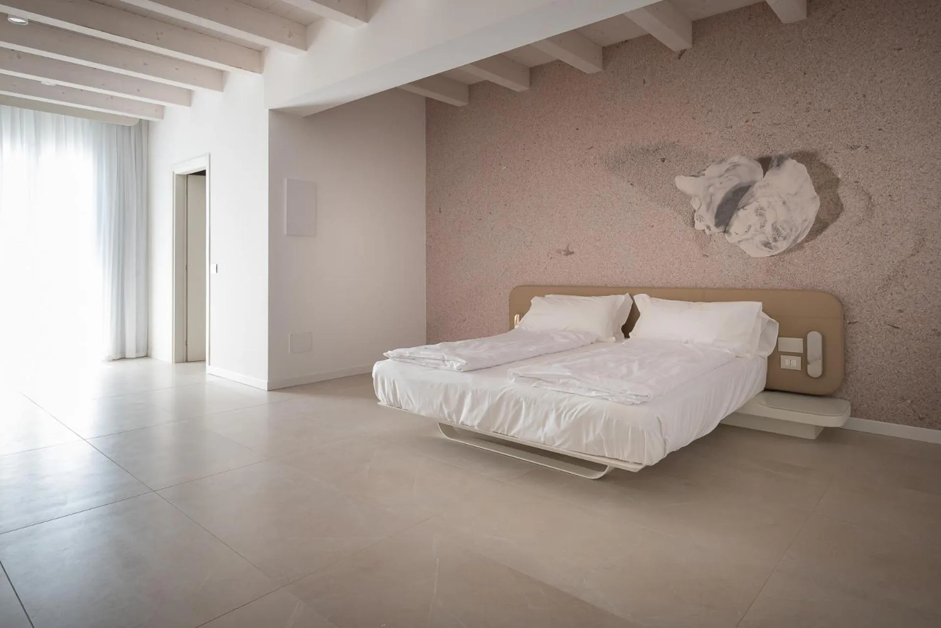 Bed in Unico Hotel Caorle