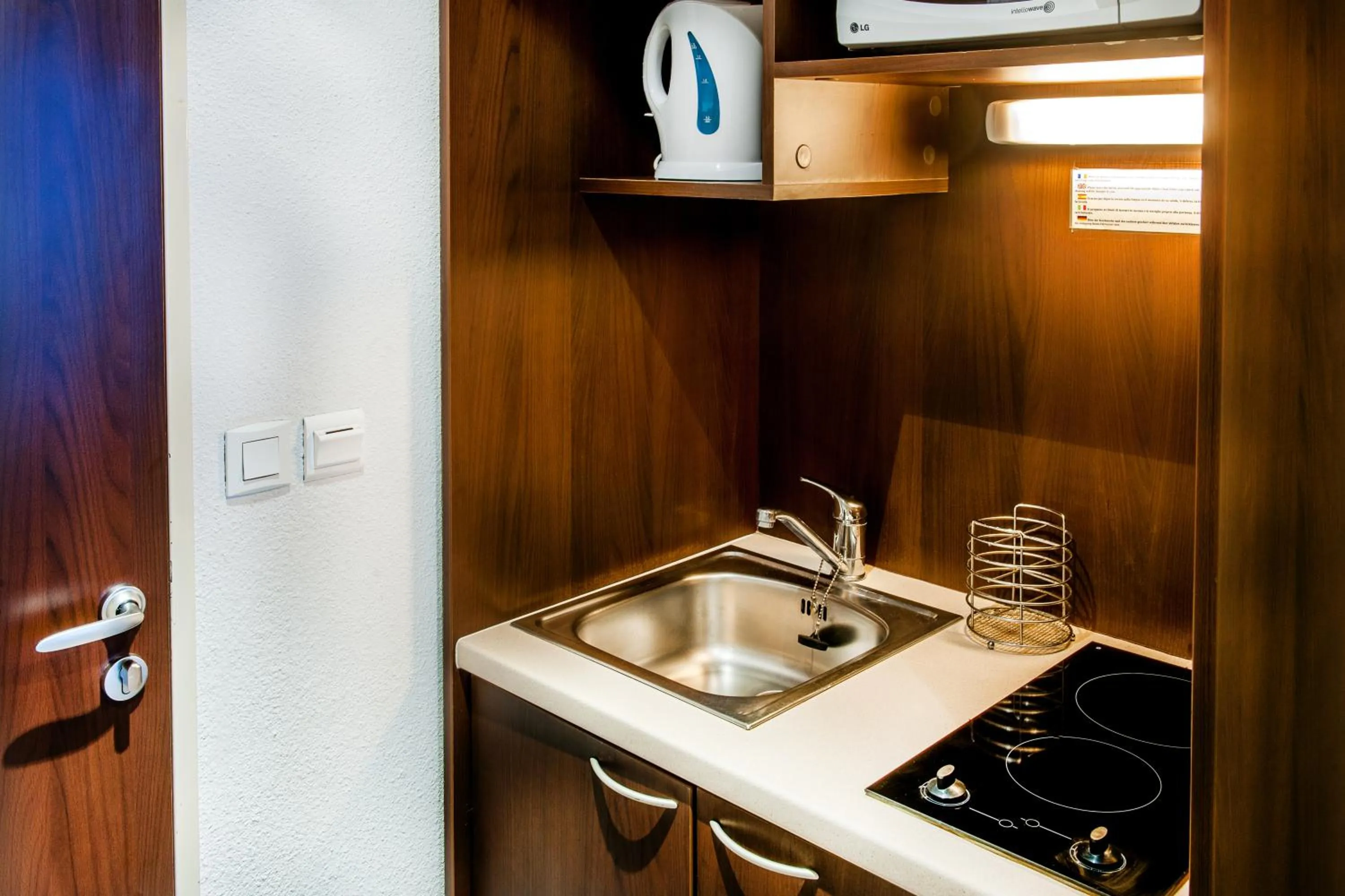 Kitchen or kitchenette in Appart'hôtel Saint Jean