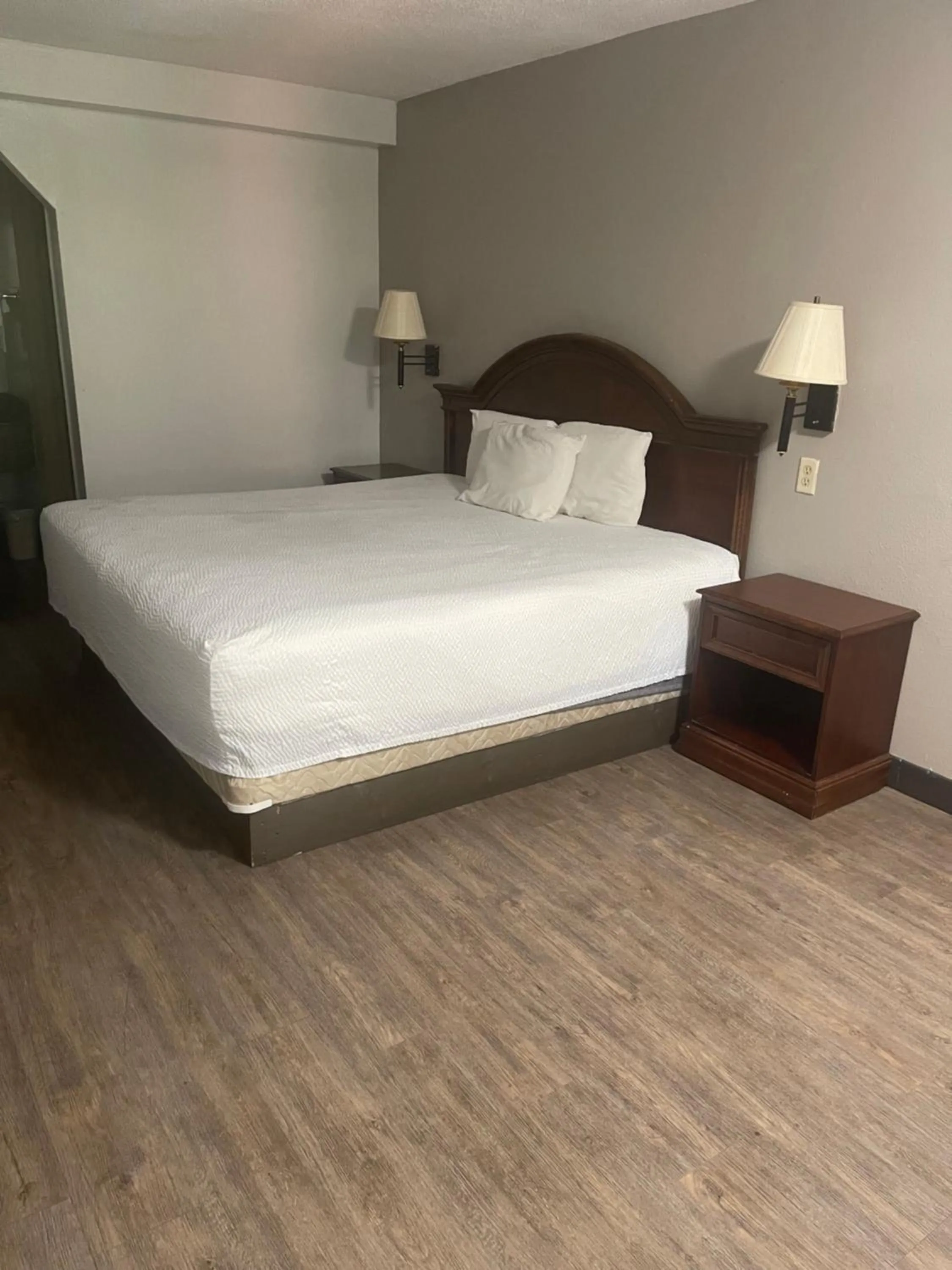 Bed in FairBridge Inn & Suites