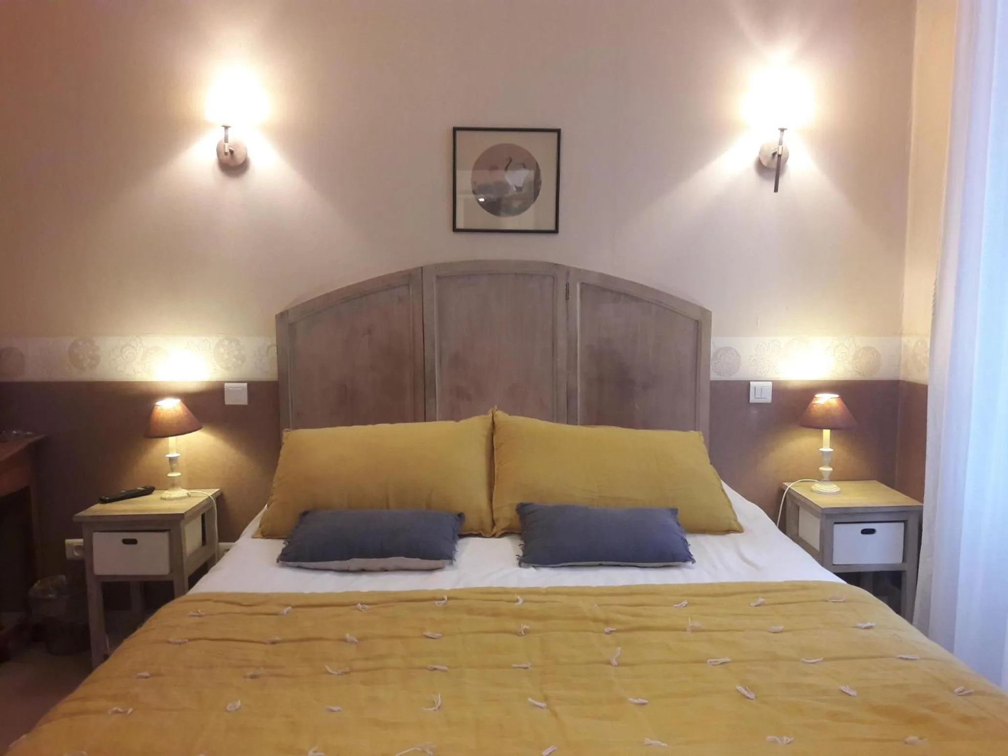 Bed in LogisHotels Le Relais du Quercy